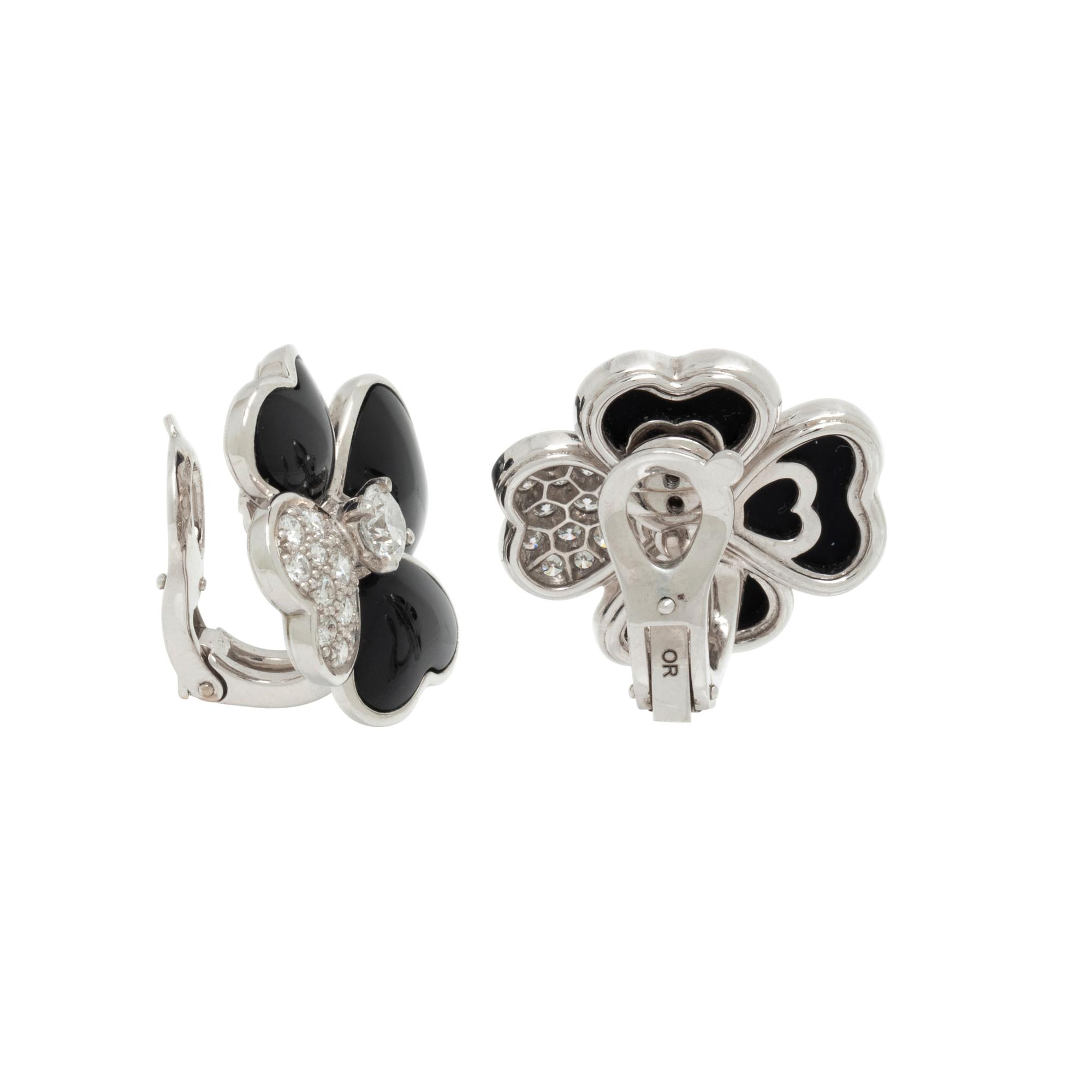 VAN CLEEF & ARPELS, DIAMOND, ONYX, AND WHITE GOLD 'COSMOS' CLIP EARRINGS