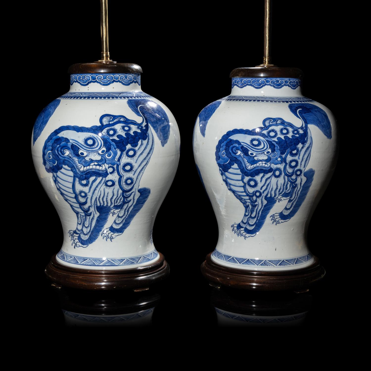 A Pair of Chinese Blue and White 'Buddhist Lion' Porcelain Jars, Kangxi Period or Later 清康熙或更晚 青花佛獅紋罐一對