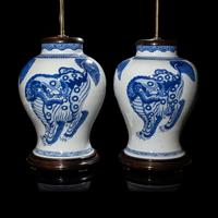 A Pair of Chinese Blue and White 'Buddhist Lion' Porcelain Jars, Kangxi Period or Later 清康熙或更晚 青花佛獅紋罐一對