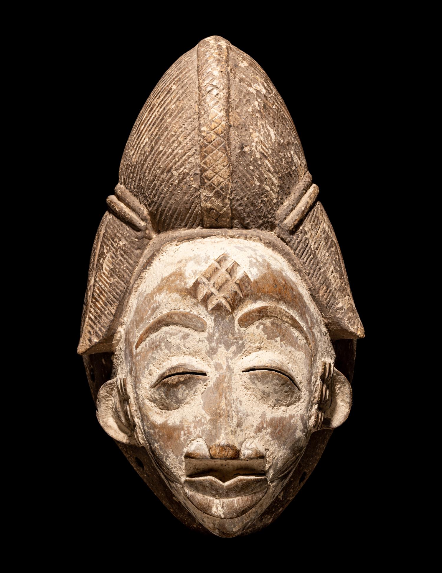 Four Punu Wood Masks