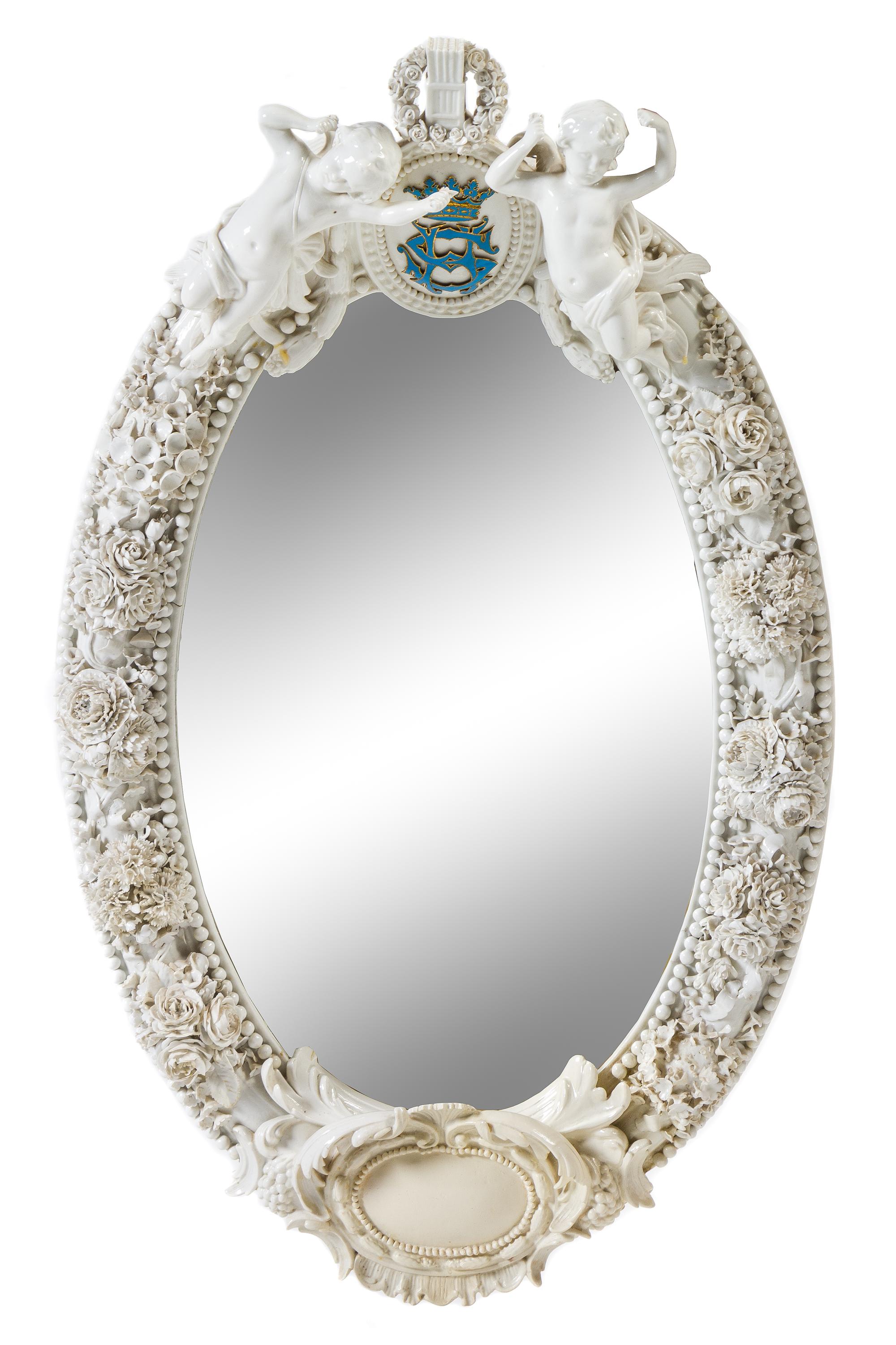 A German Porcelain Mirror Height 29 inches. — 19TH CENTURY