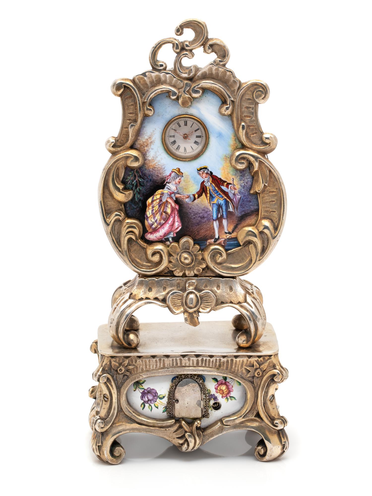 GILT-METAL AND ENAMEL CLOCK WITH HIDDEN AUTOMATON
