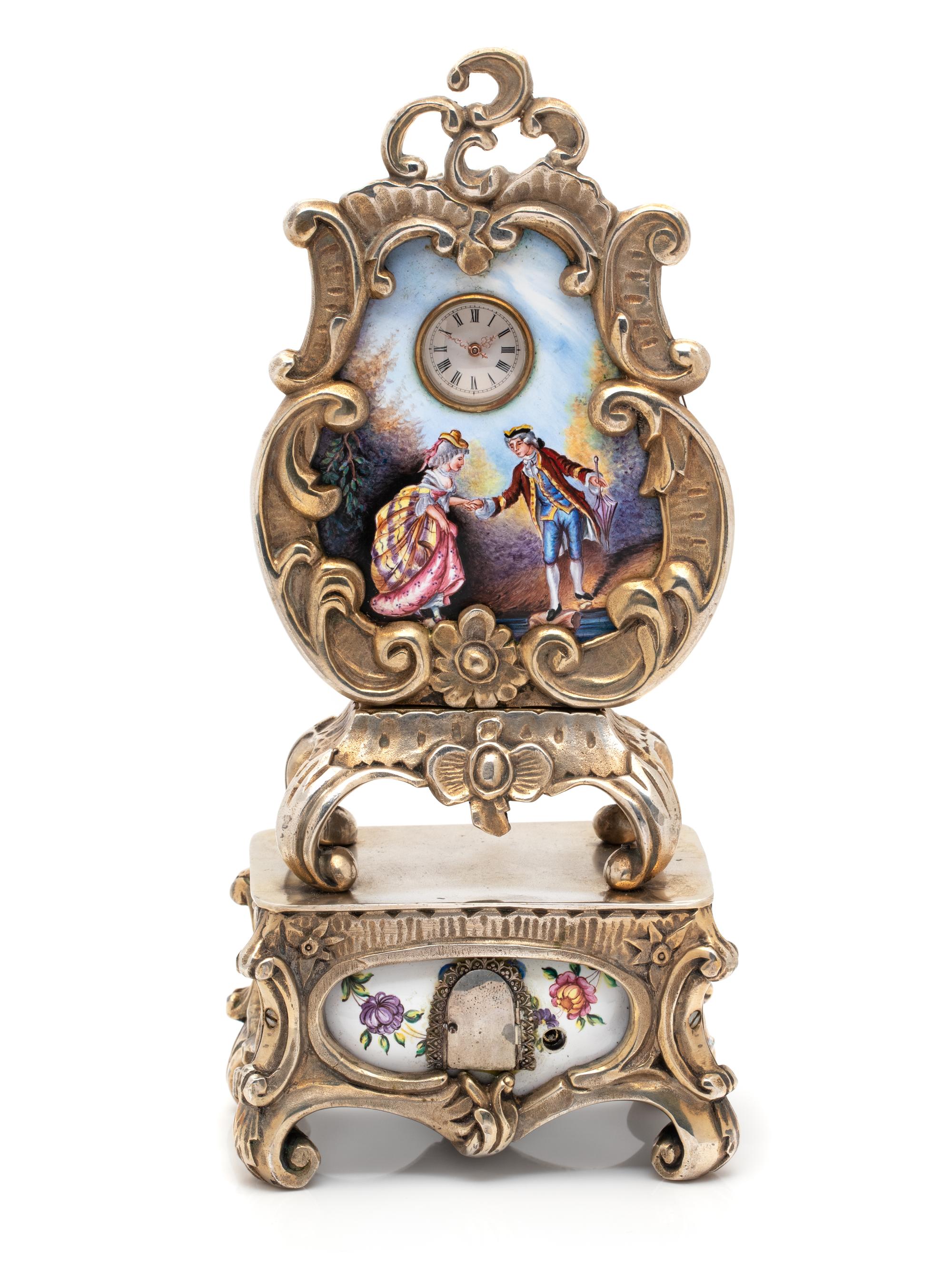 GILT-METAL AND ENAMEL CLOCK WITH HIDDEN AUTOMATON