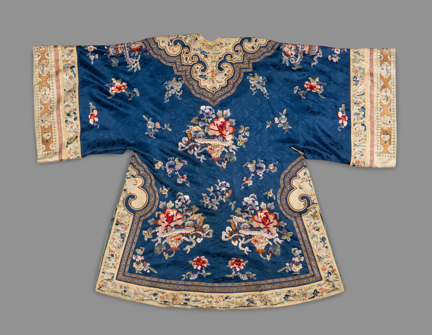 A Chinese Blue Ground Embroidered Silk Lady's Coat, Ao