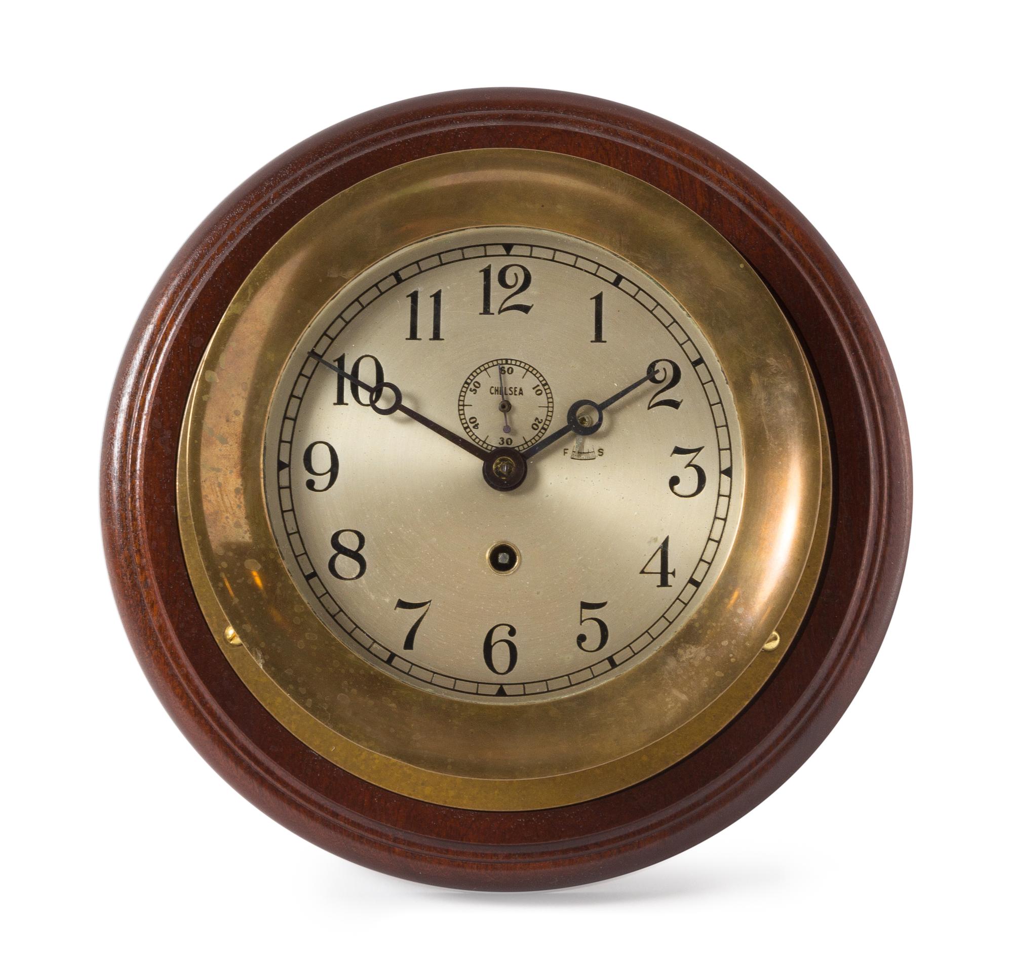 A Chelsea Brass Ship's Clock Diameter 9 1/2 inches. — 20TH CENTURY