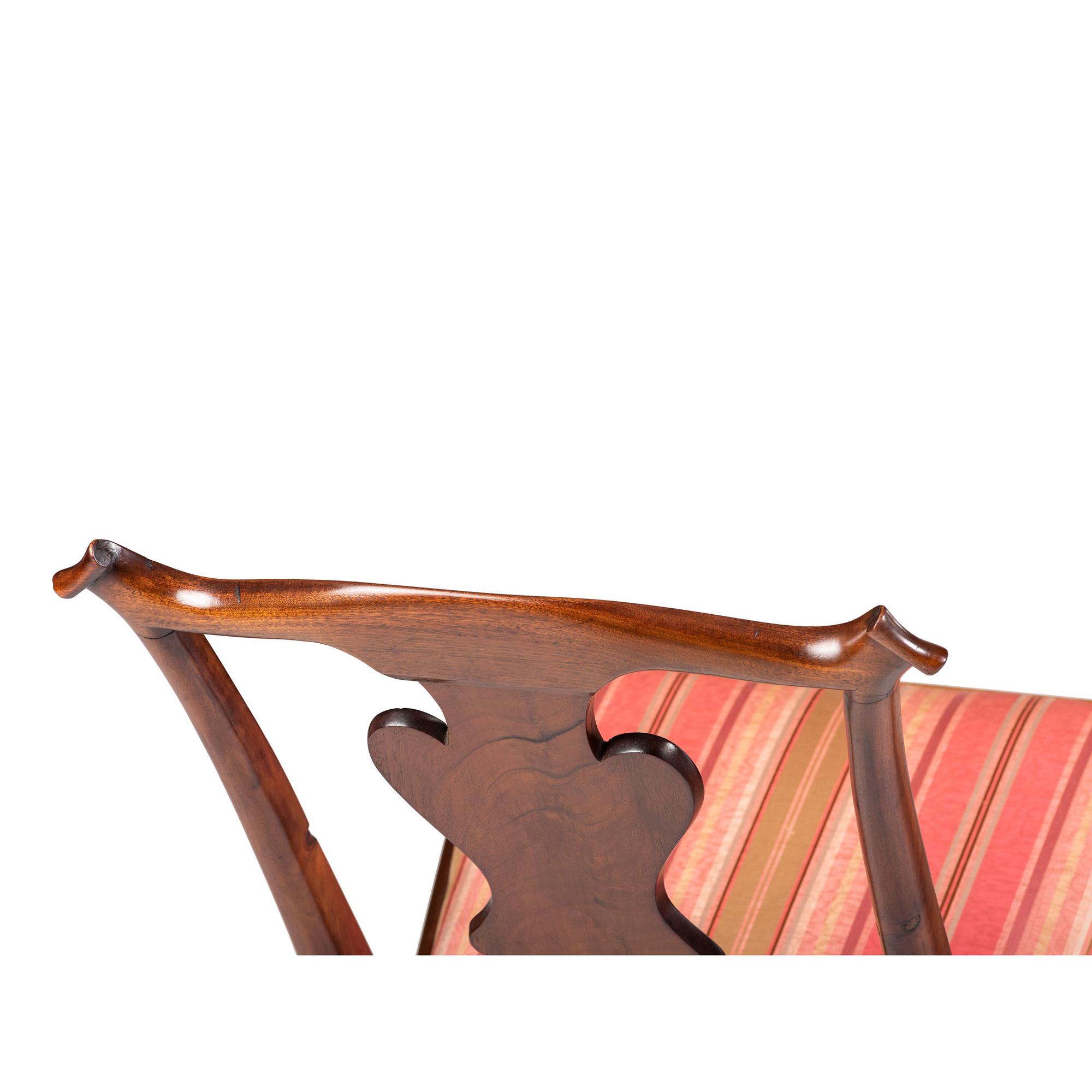 A Queen Anne Carved and Figured Walnut Side Chair