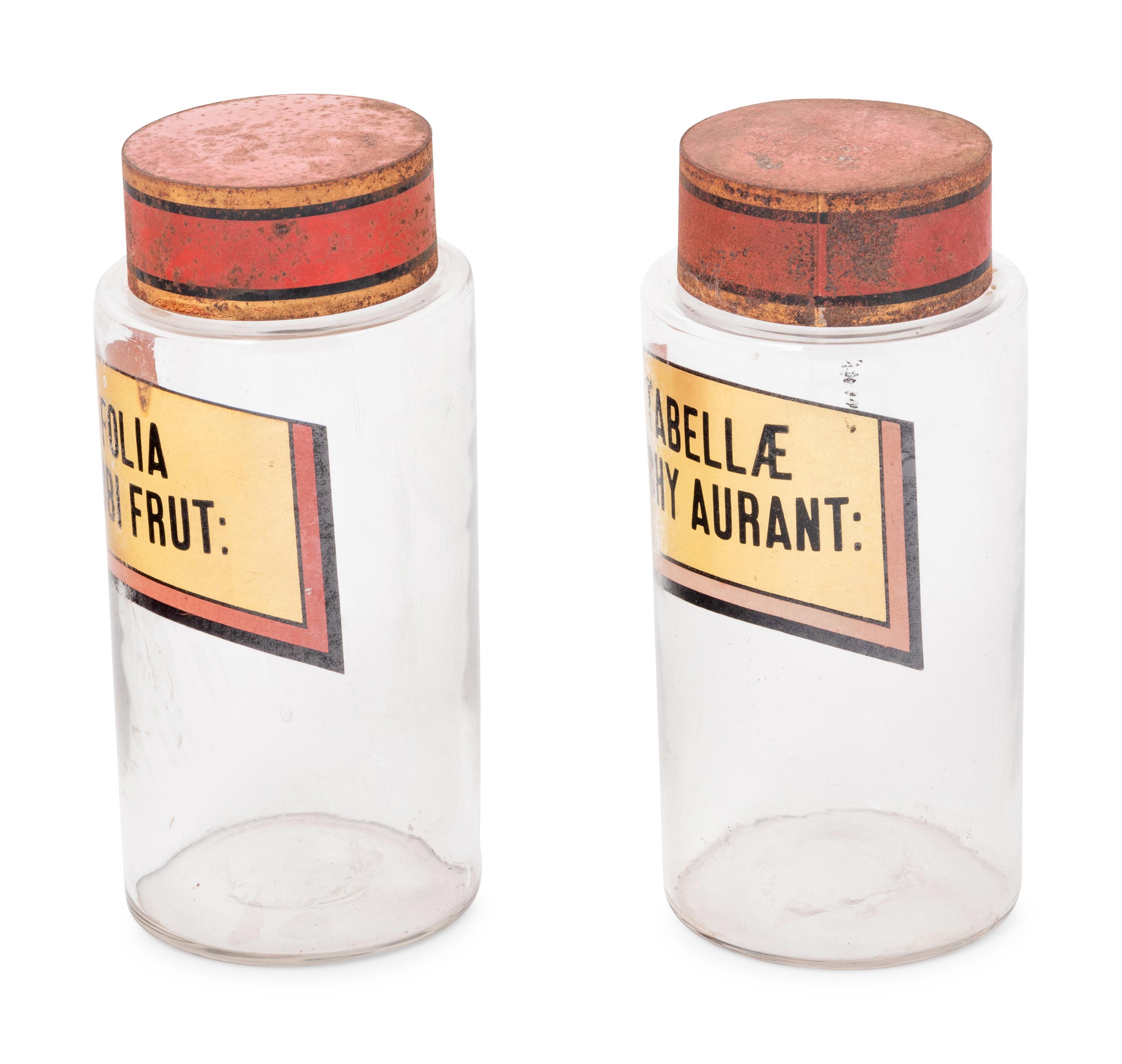 A Pair of Clear Glass Apothecary Jars