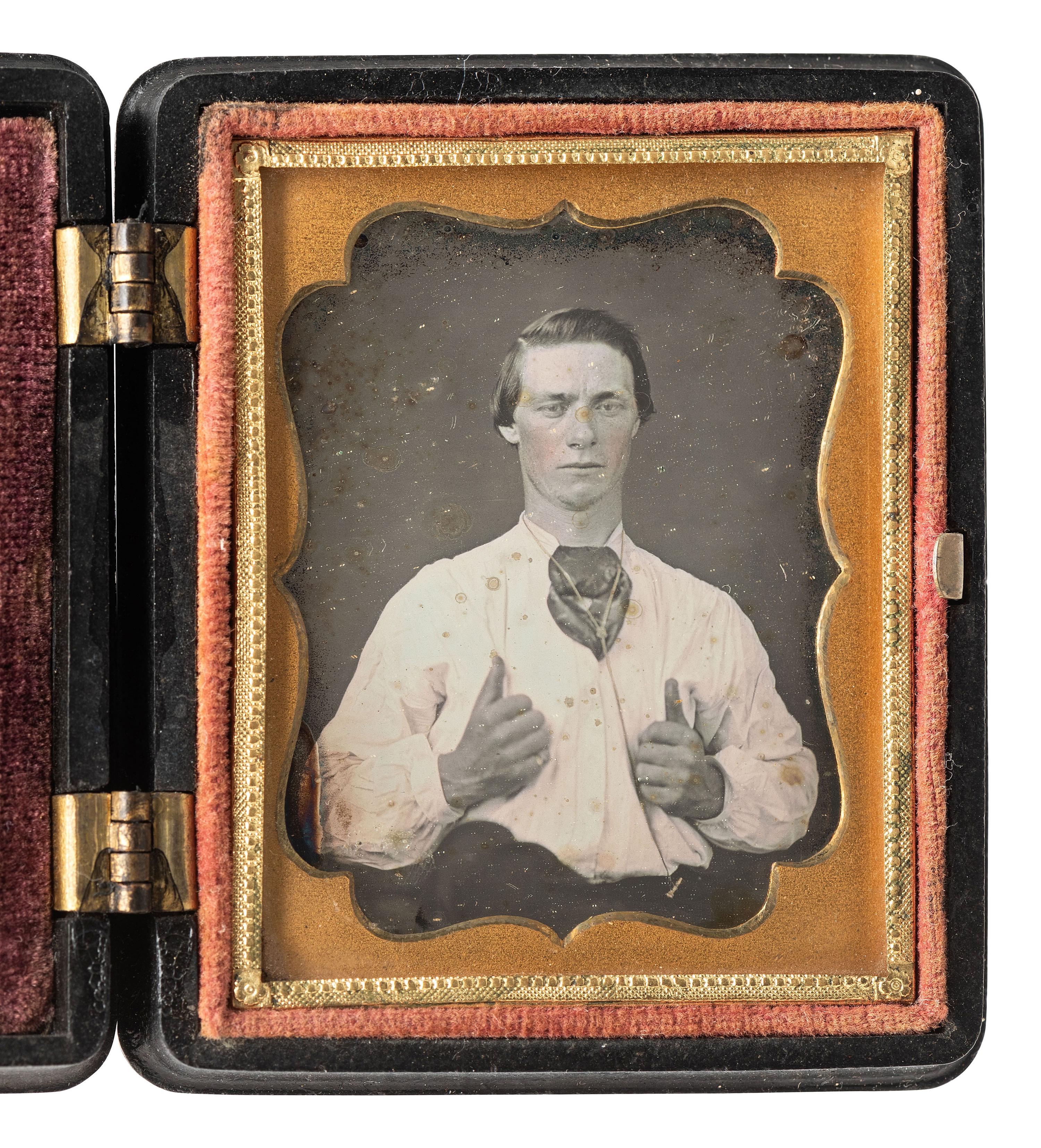 [EARLY PHOTOGRAPHY]. Ninth plate daguerreotype of a man giving the camera "two thumbs up!"