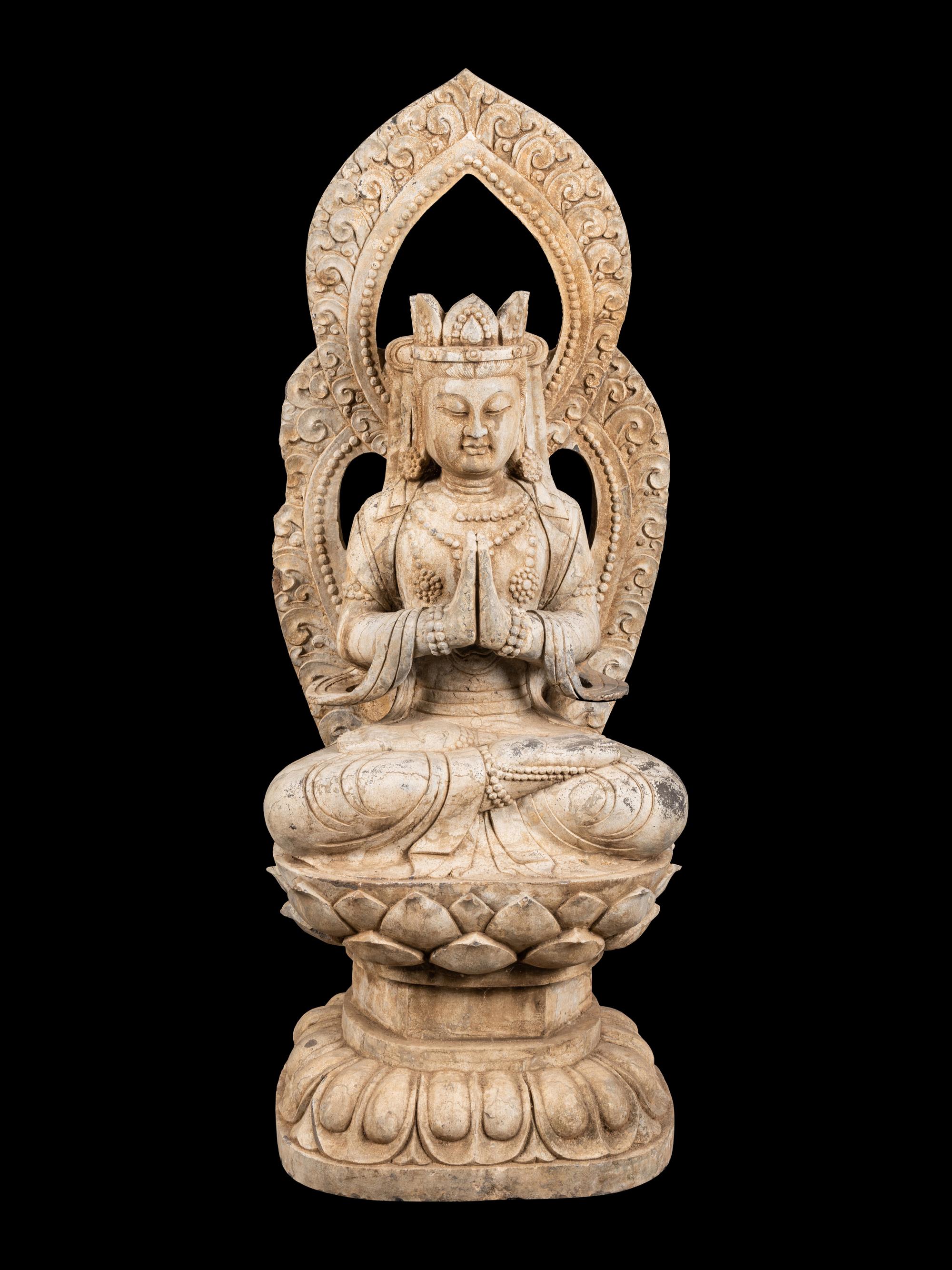 A Chinese Carved Stone Seated Guanyin Figure