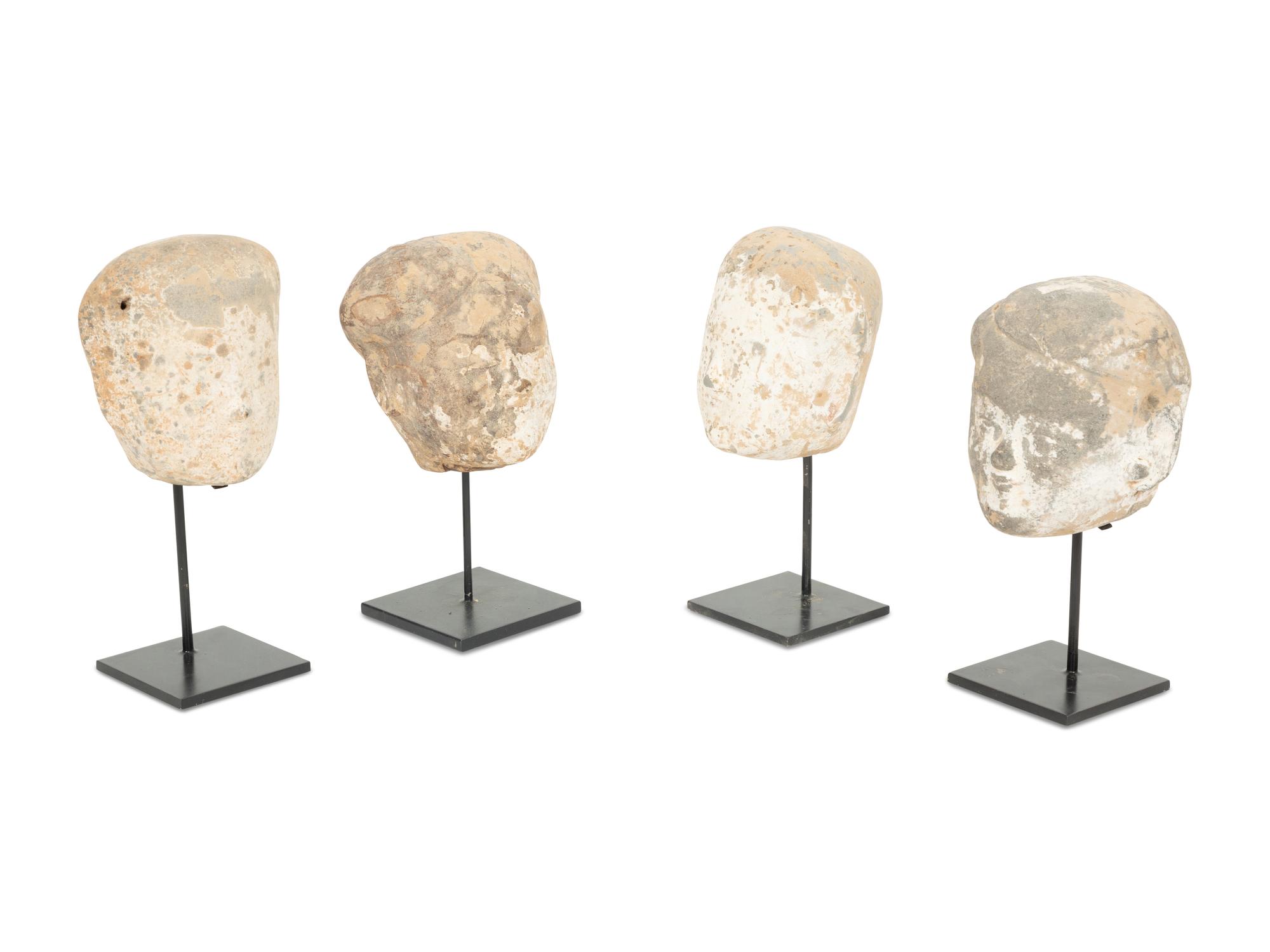 Four Tang Pottery Heads on Stands