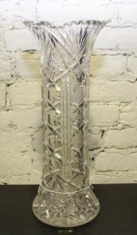 A Cut Glass Vase. Height 16 1/2 inches.