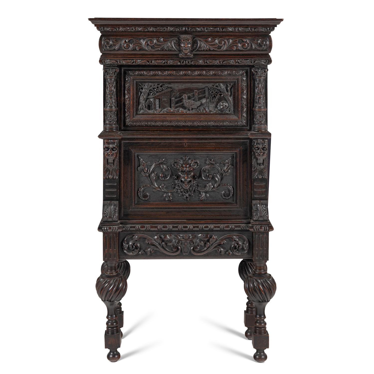 An Italian Renaissance Revival Carved Oak Bureau Cabinet on Stand