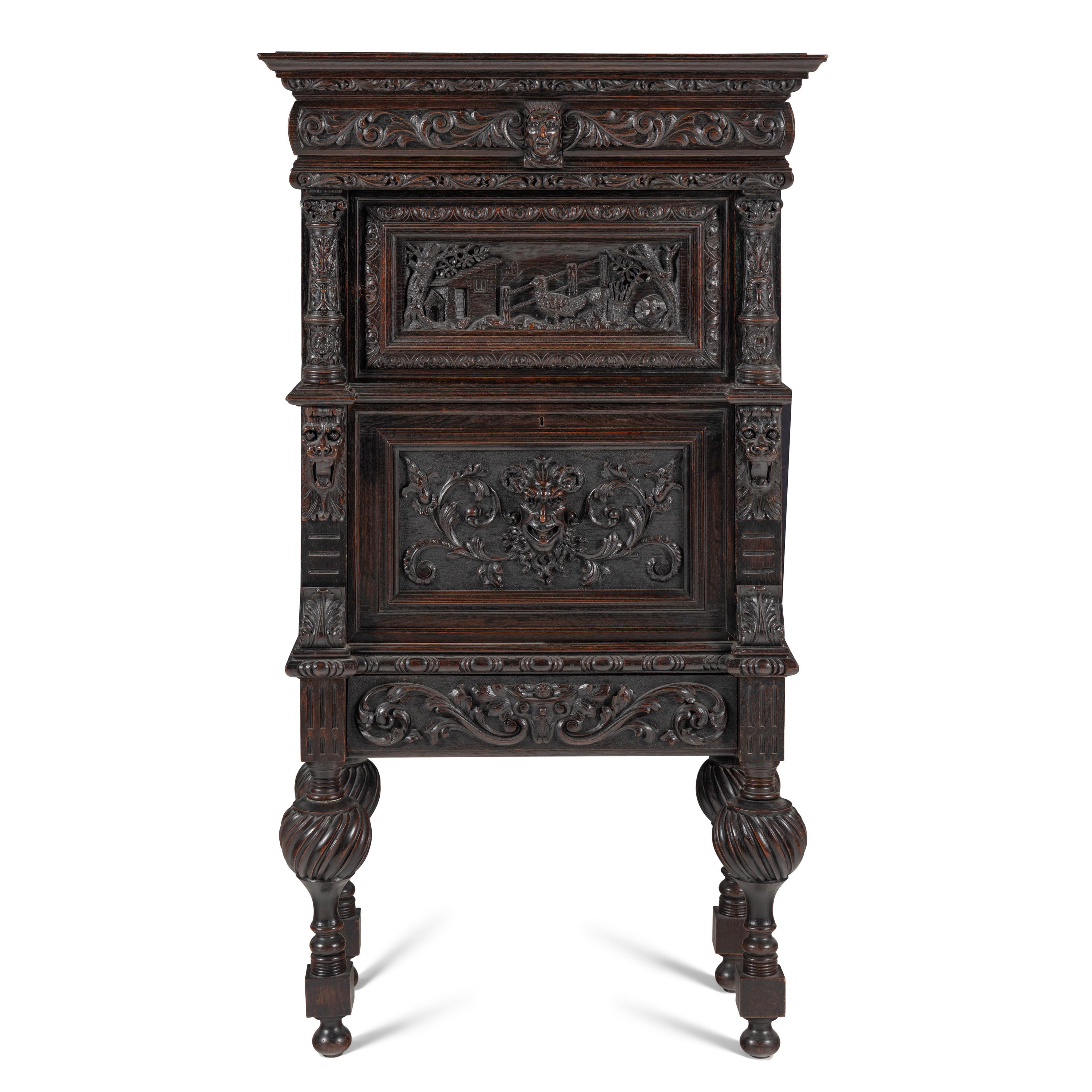 An Italian Renaissance Revival Carved Oak Bureau Cabinet on Stand