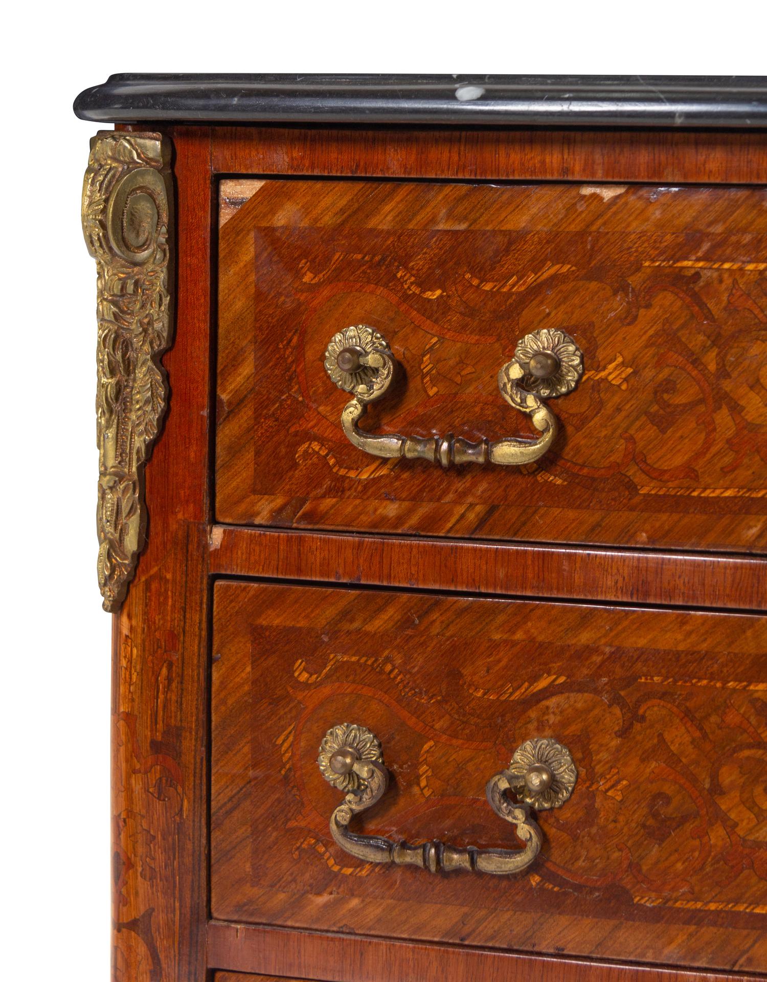 A Louis XV/XVI Transitional Style Gilt Bronze Mounted Marquetry Chest of Drawers