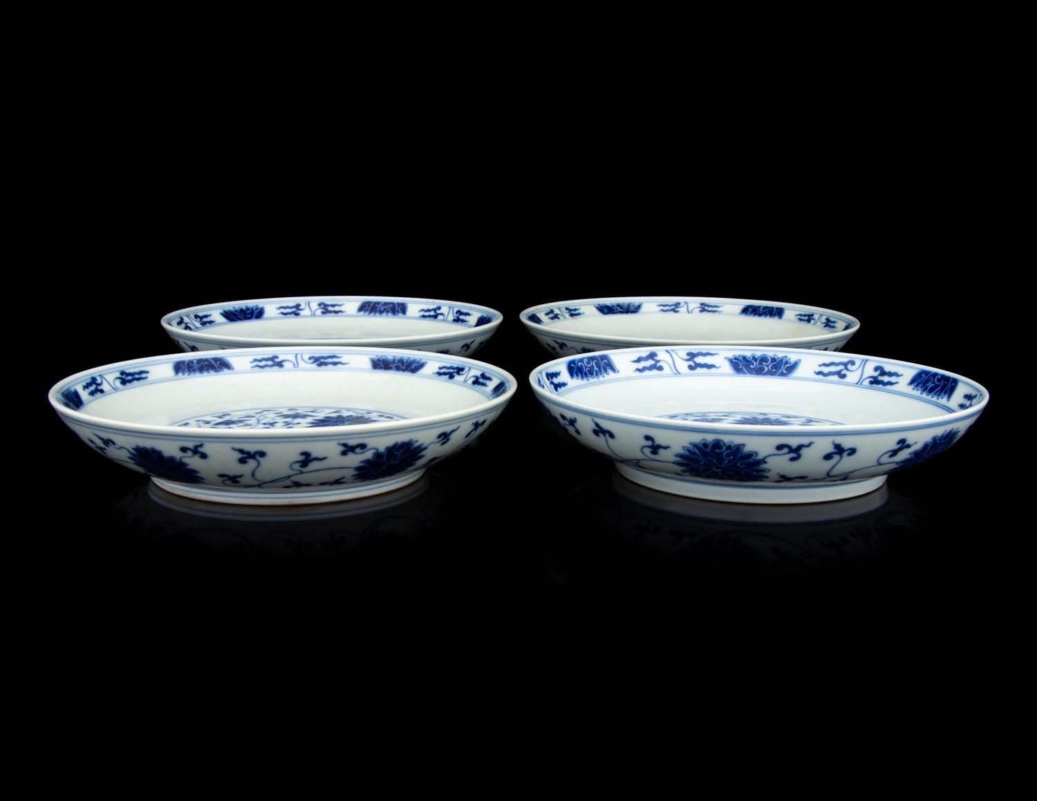 Four Chinese Blue and White Porcelain 'Lotus' Plates