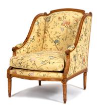 A Louis XVI Style Carved Fruitwood Bergere Height 37 inches. — 19TH CENTURY