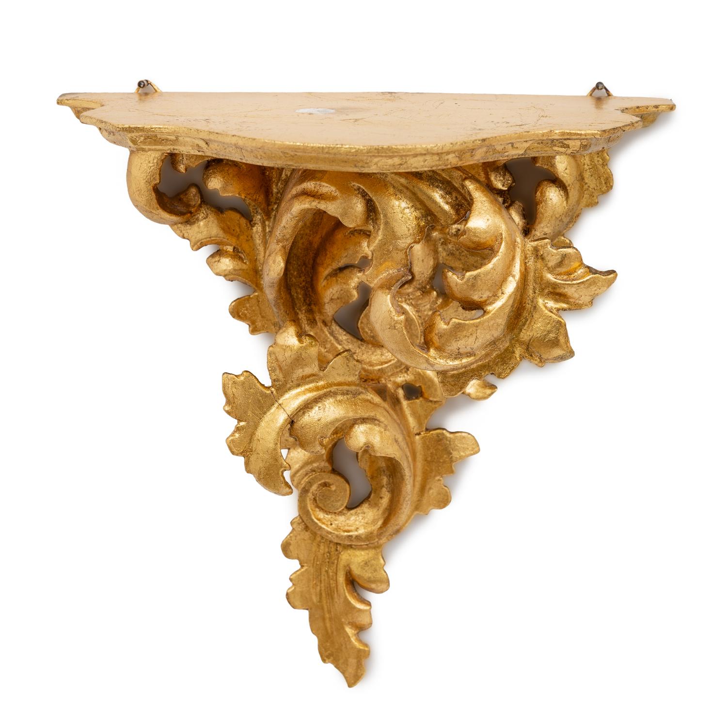 An Italian Rococo Style Carved Giltwood Oval Mirror and a Pair of Wall Brackets