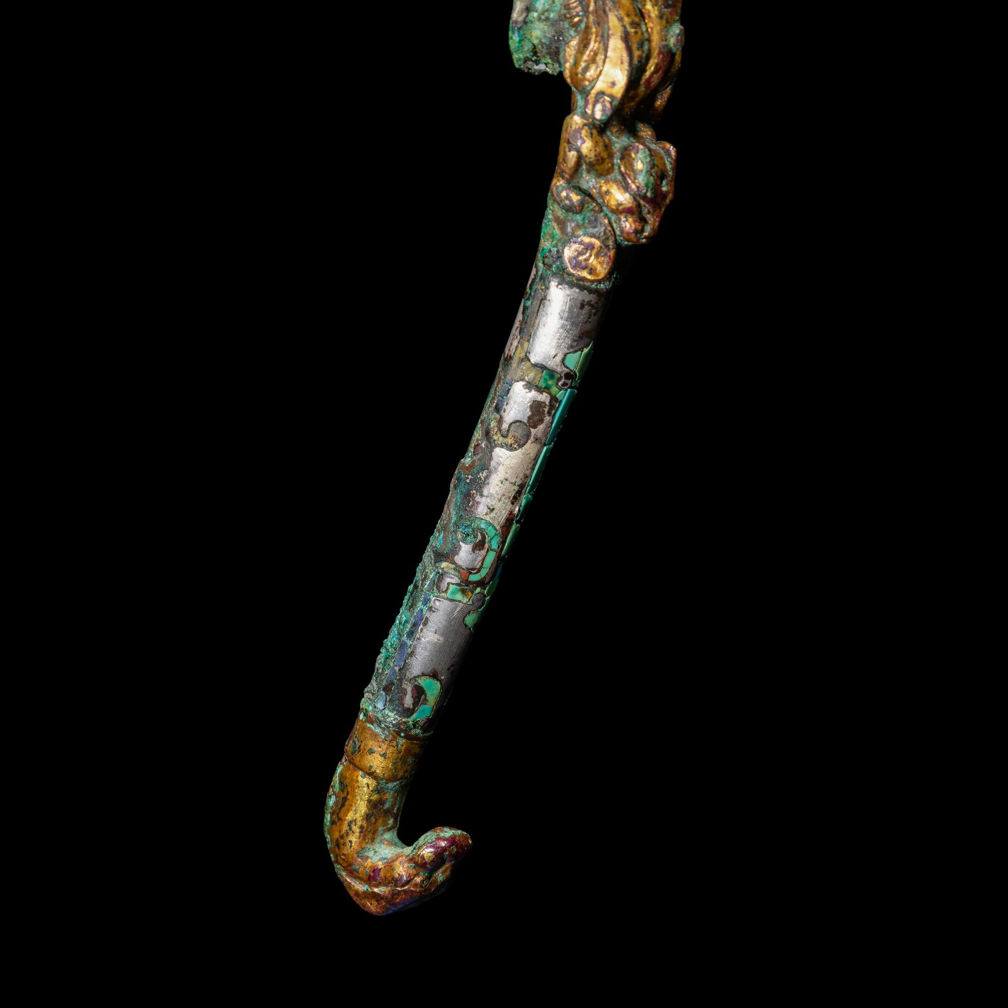 A Chinese Gilt, Silvered and Turquoise Inlaid Bronze Belt Hook, Warring States Period 戰國 銅 鎏金錯銀嵌松石雙獸首帶鉤