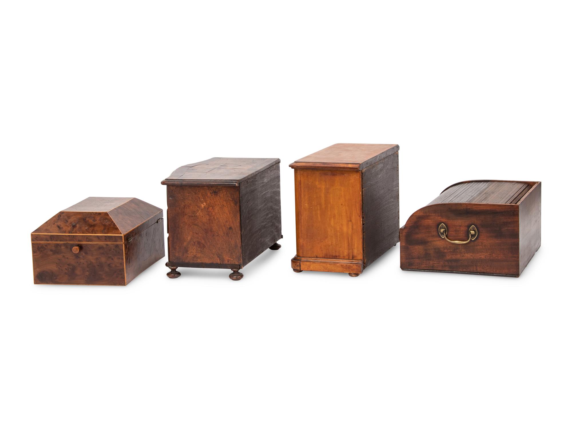 An English Yew Wood Tea Caddy, Two Diminutive Chests of Drawers and a Writing Box