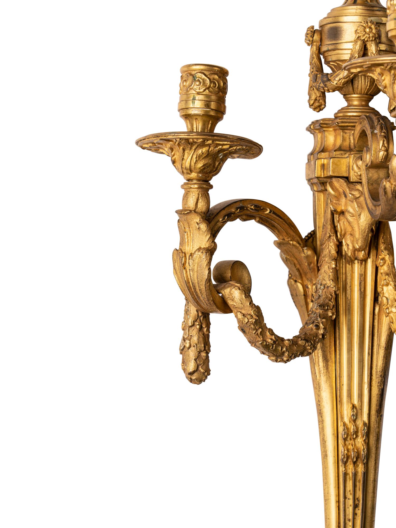 A Pair of Louis XVI Style Gilt Bronze Three-Light Sconces