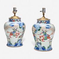 A pair of large Chinese wucai-decorated porcelain jars, mounted as lamps