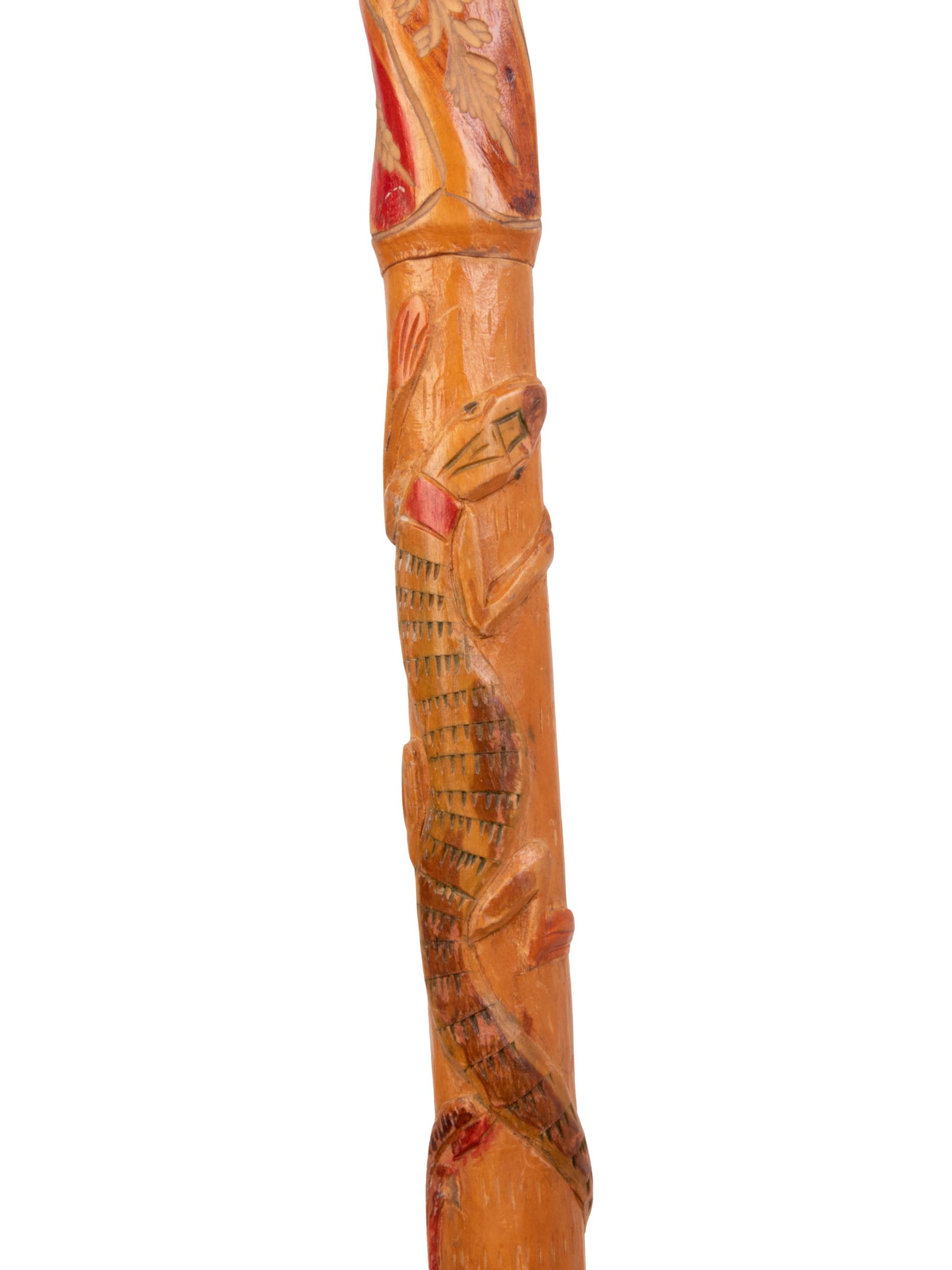 A Folk Art Snake and Alligator Carved Walking Stick