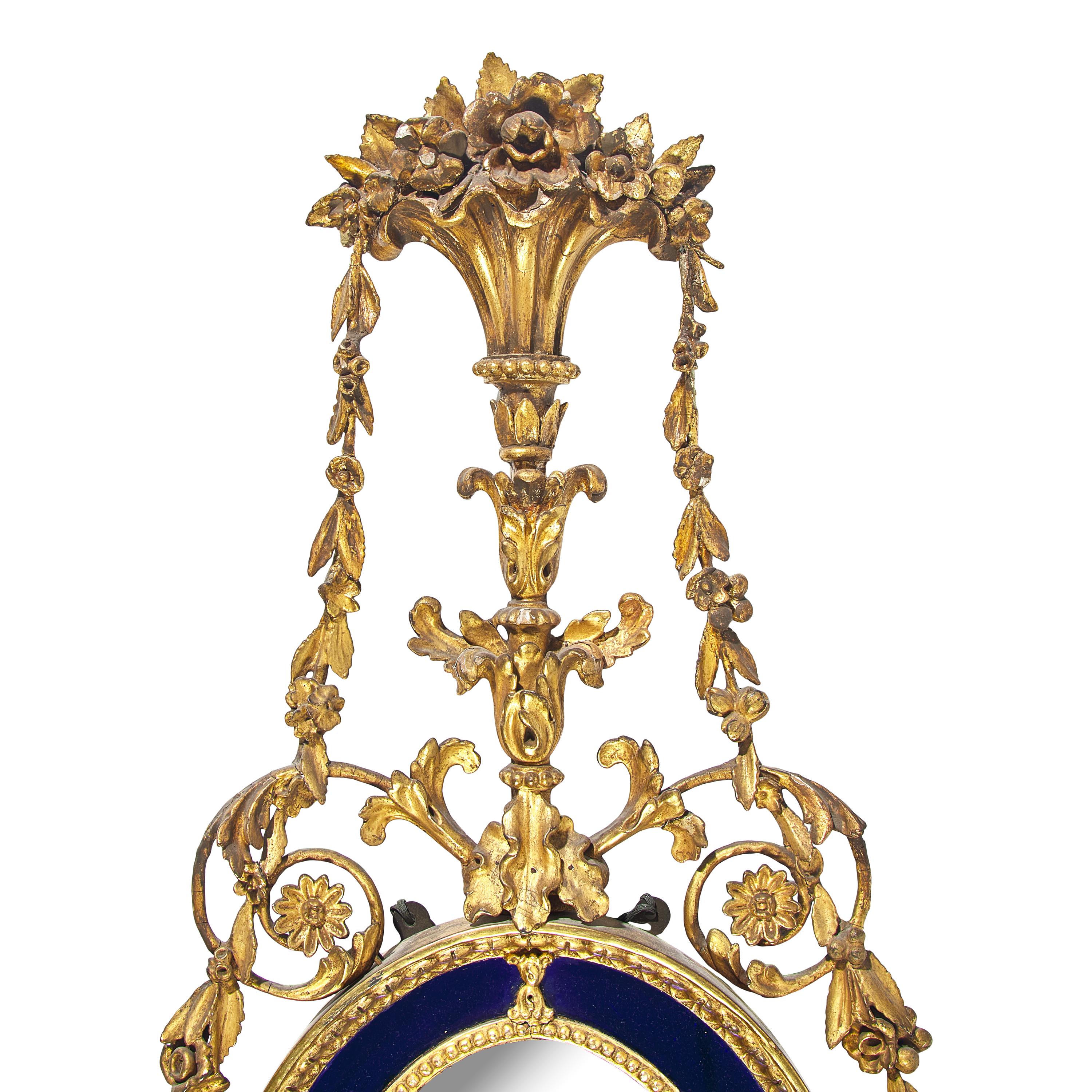 A Pair of Neoclassical Cobalt Glass-Inset and Giltwood Mirrors