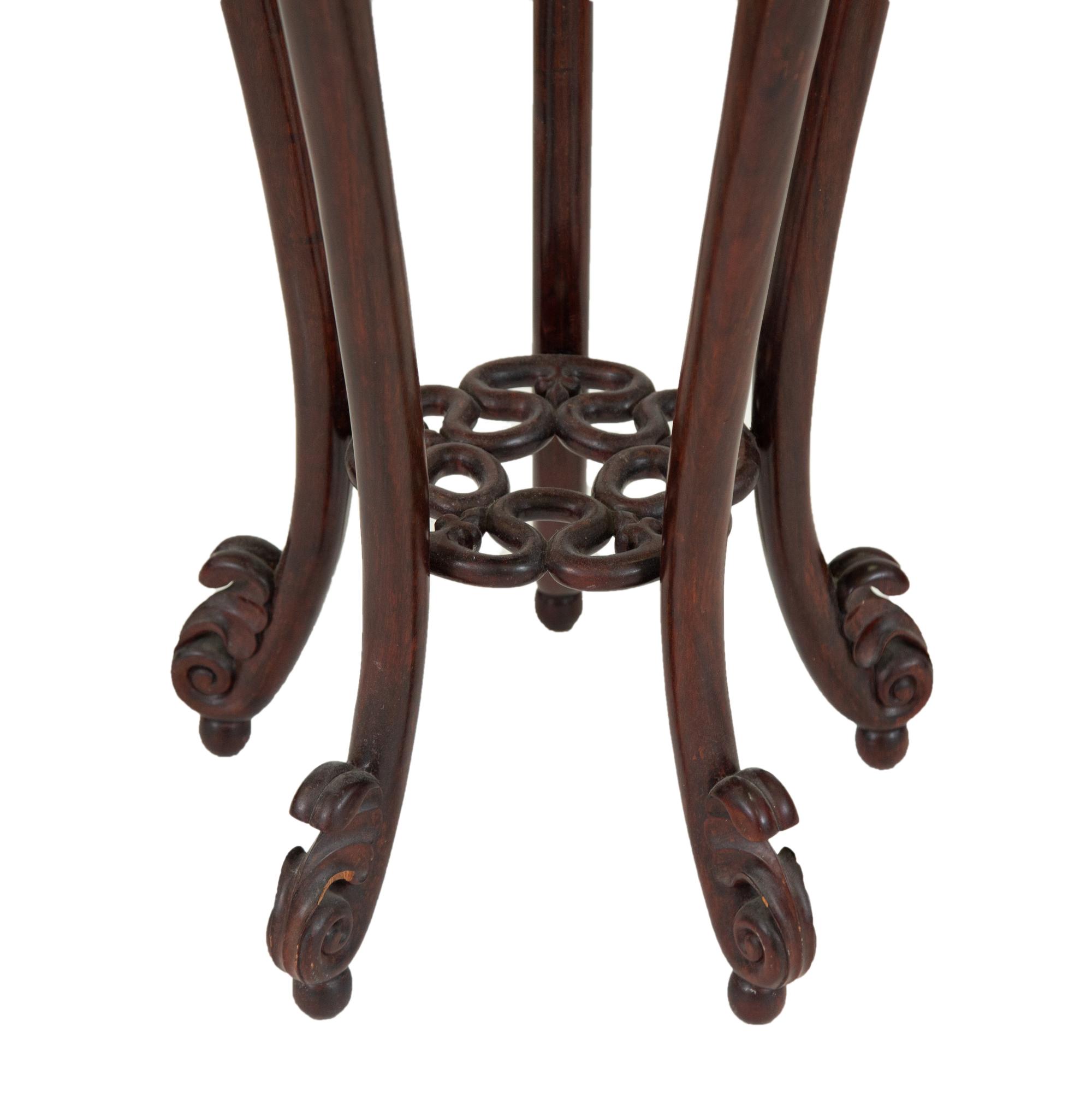 A Chinese Carved Rosewood Jardinière Stand