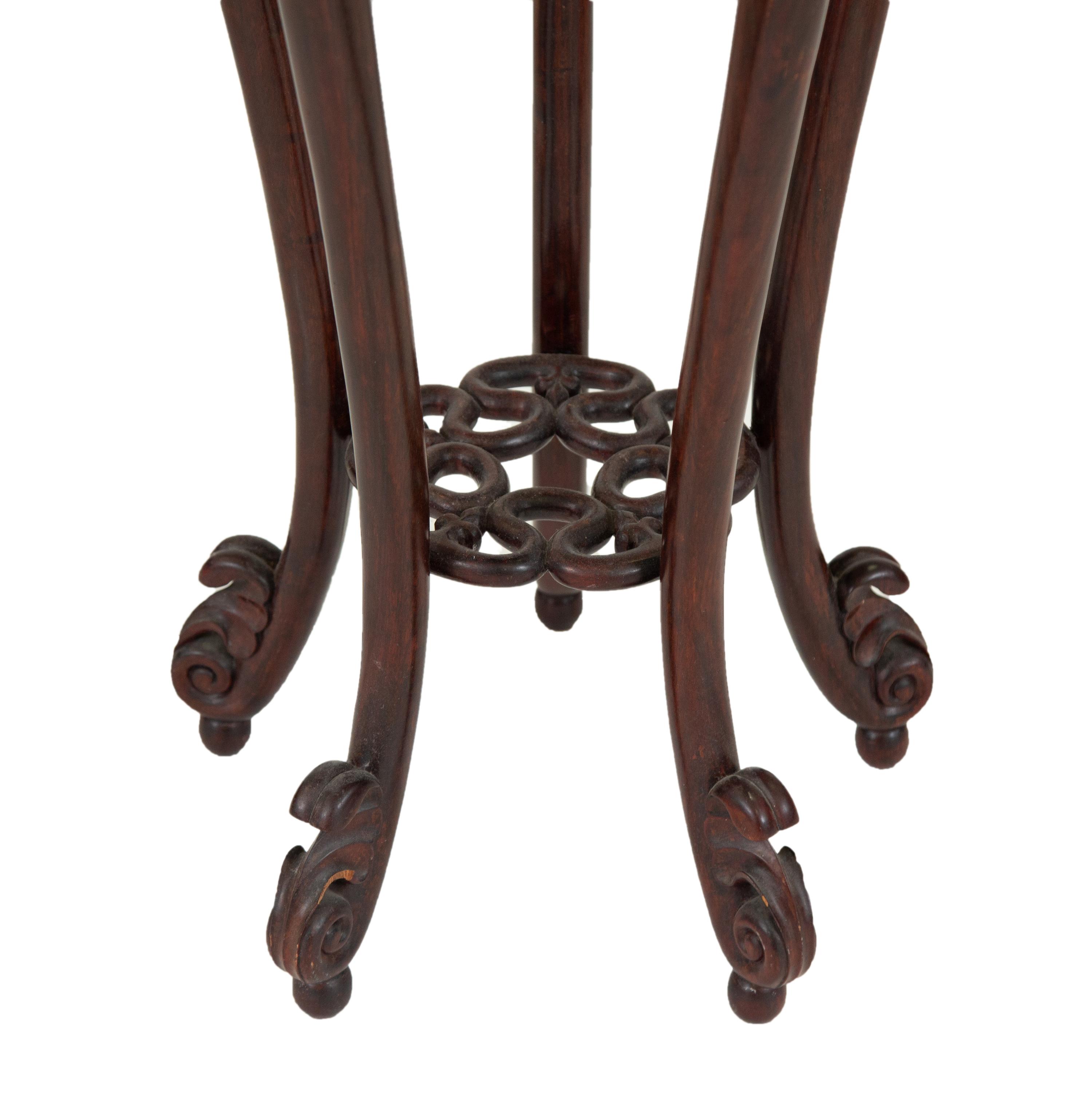 A Chinese Carved Rosewood Jardinière Stand