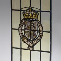 Window depicting a painted coat of arms