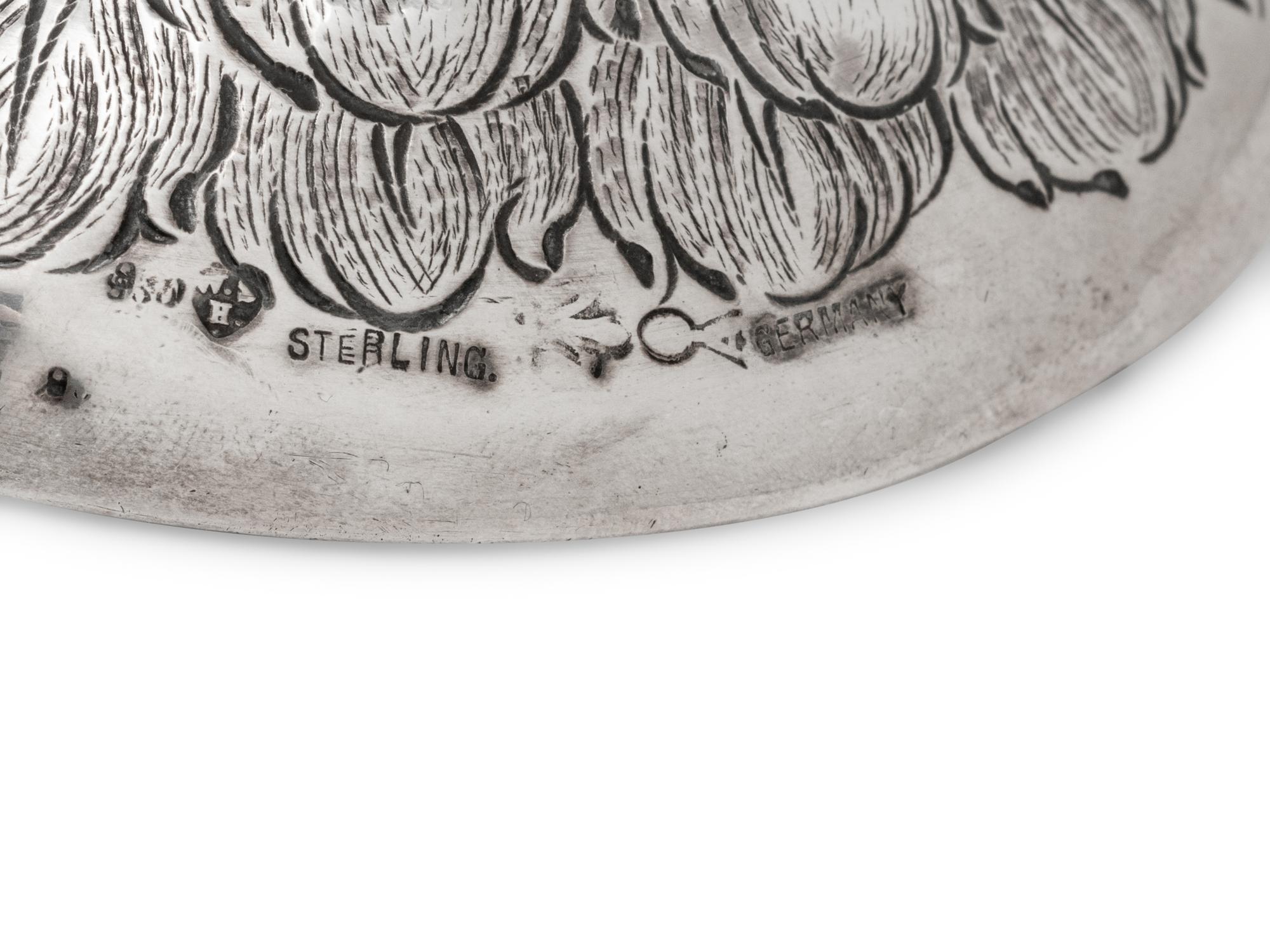 A German Silver-Mounted Glass Eagle-Form Decanter
