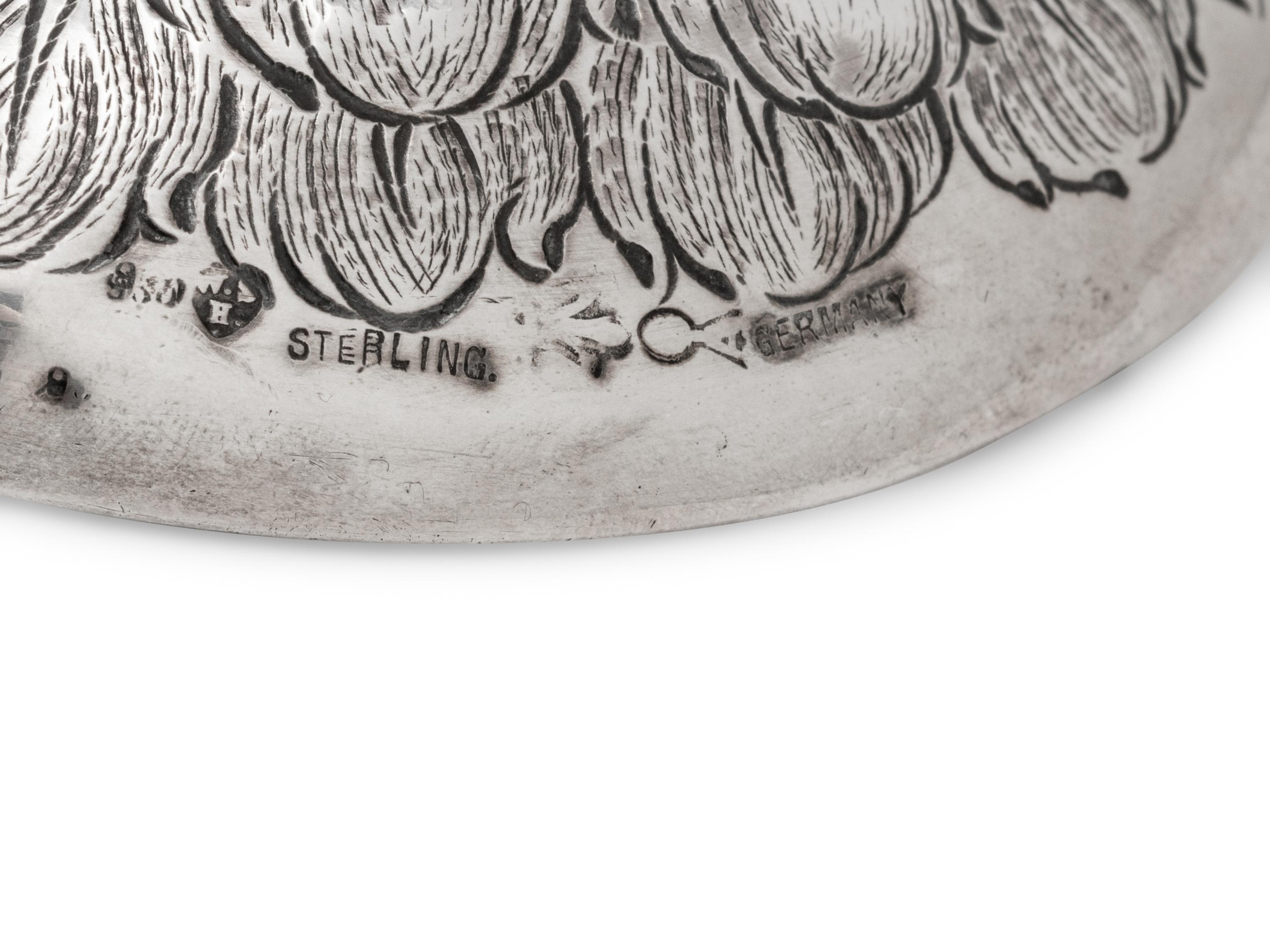 A German Silver-Mounted Glass Eagle-Form Decanter
