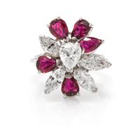 An 18 Karat White Gold, Diamond and Ruby Spray Ring, 4.20 dwts.