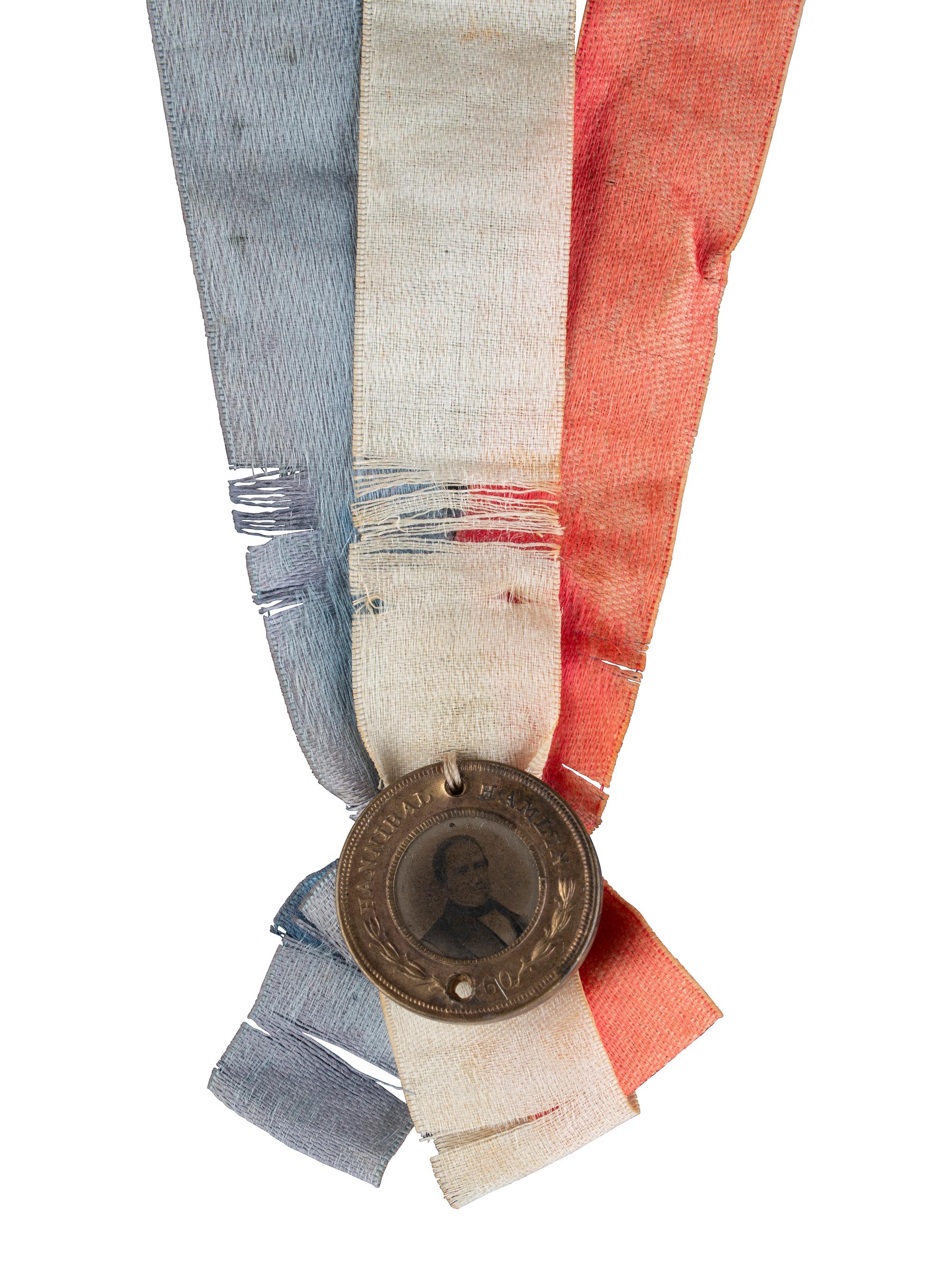 [LINCOLN, Abraham (1809-1865)]. Abraham Lincoln and Hannibal Hamlin back-to-back campaign ferrotype with ribbons. 1860.