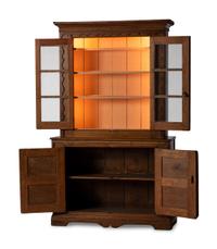 A Folk Art Carved and Paneled Pine Step-Back Cupboard