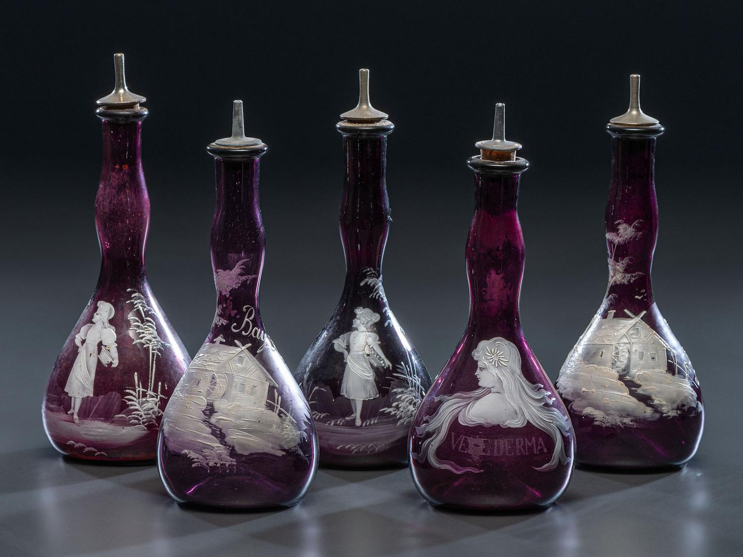 Five 'Mary Gregory' Enameled Amethyst Barber Bottles