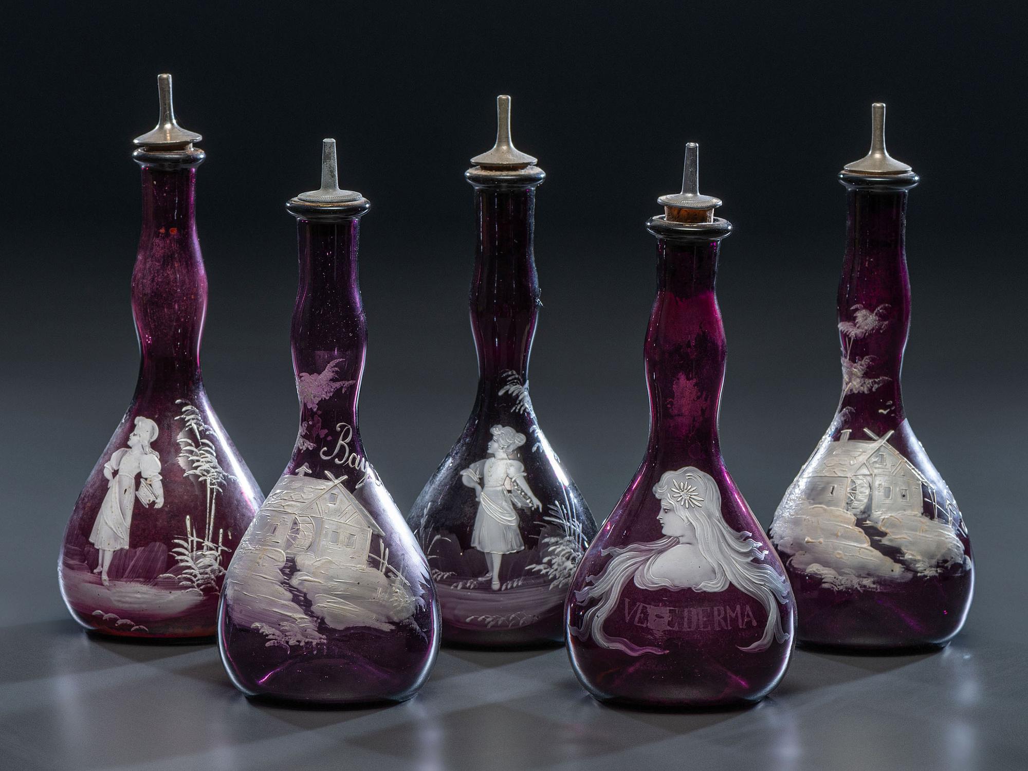 Five 'Mary Gregory' Enameled Amethyst Barber Bottles