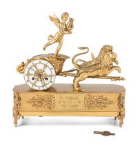 A French Ormolu Mantle Clock in the Form of a Chariot with Apollo and Lions