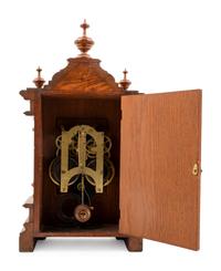 An Ansonia Cabinet A Brass Mounted Oak Shelf Clock