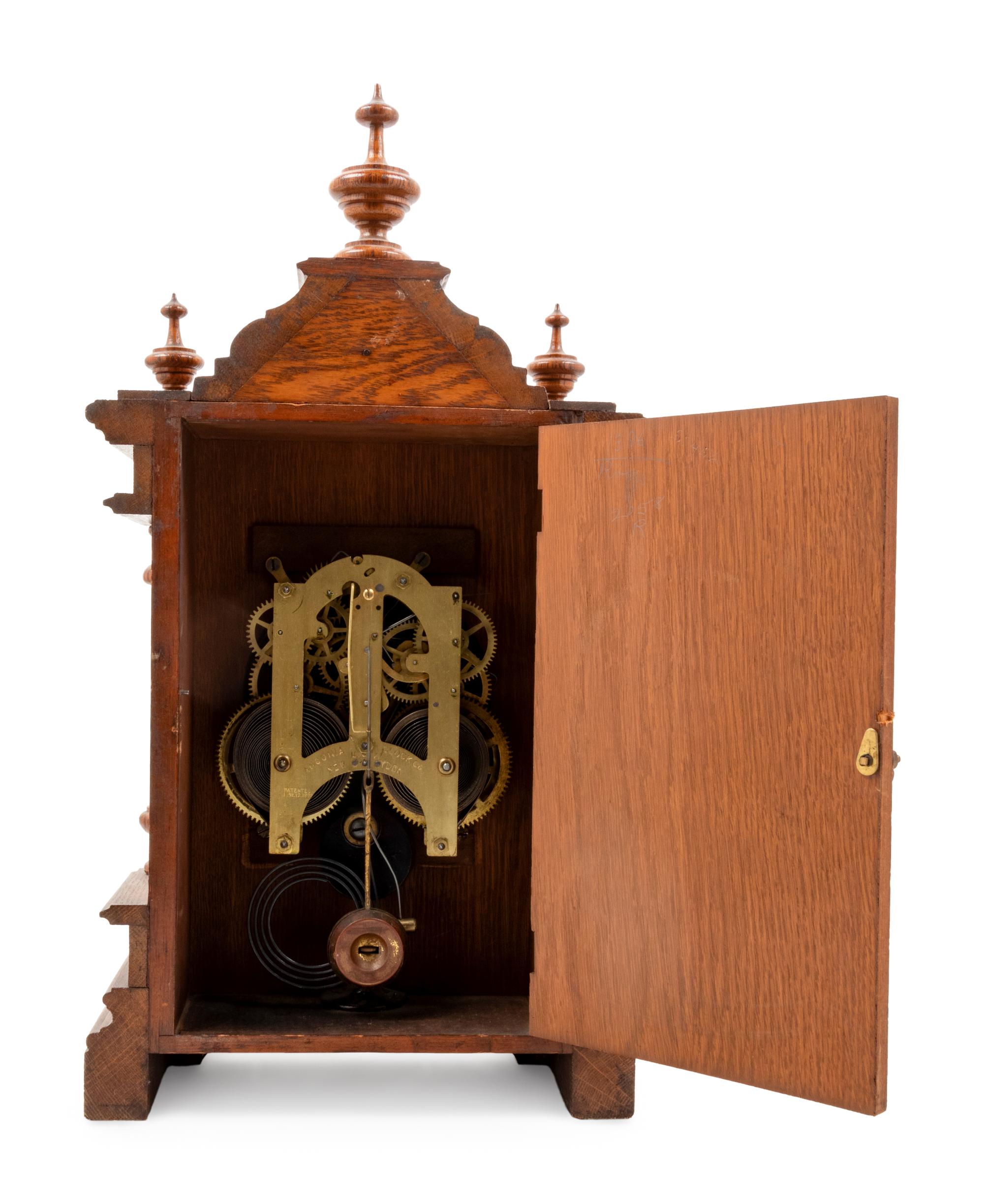 An Ansonia Cabinet A Brass Mounted Oak Shelf Clock