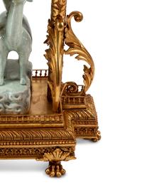 A Continental Gilt Bronze and Celadon Porcelain Figural Chinoiserie Clock