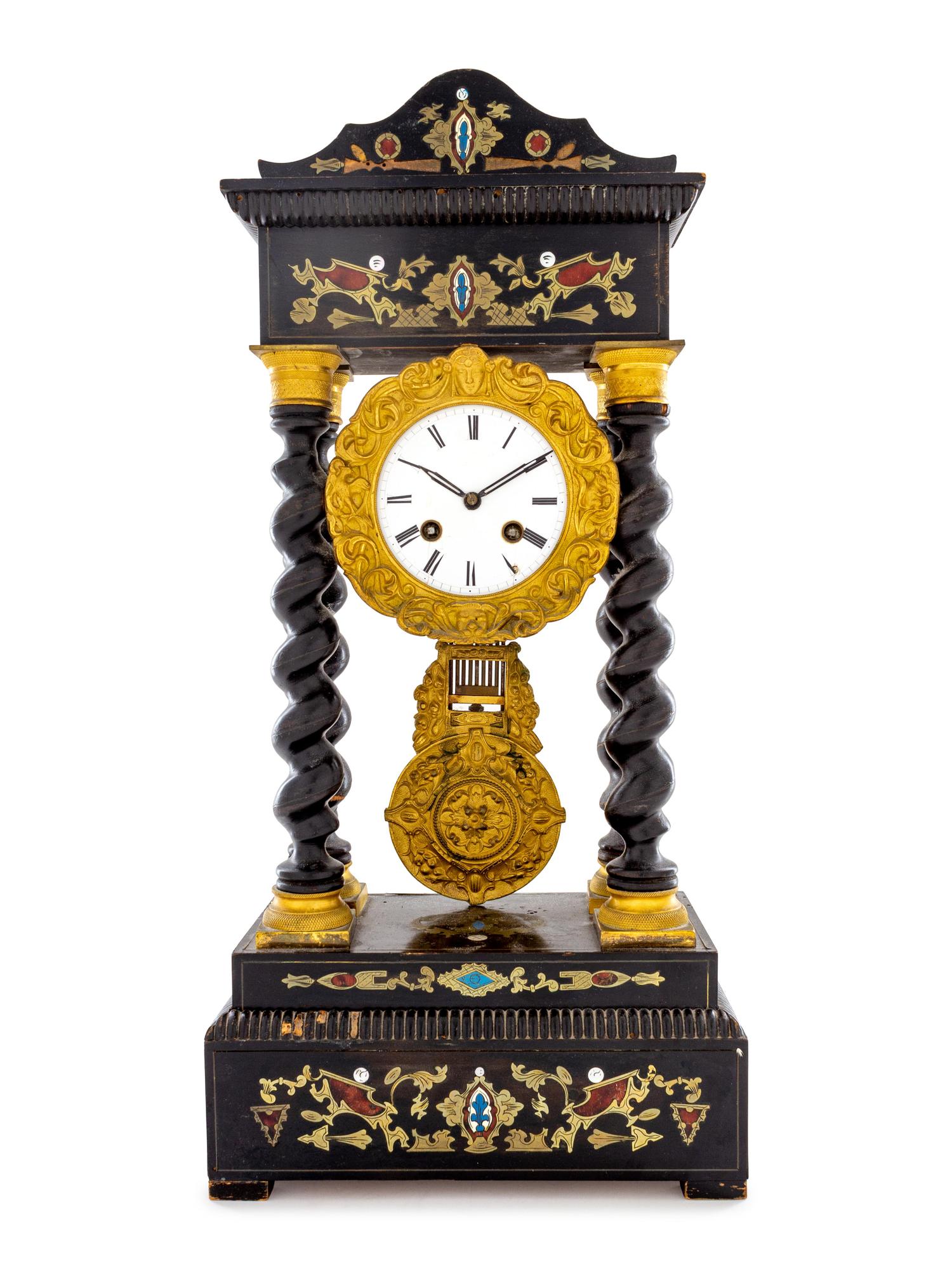 A Continental Ebonized and Brass Inlaid Portico Clock