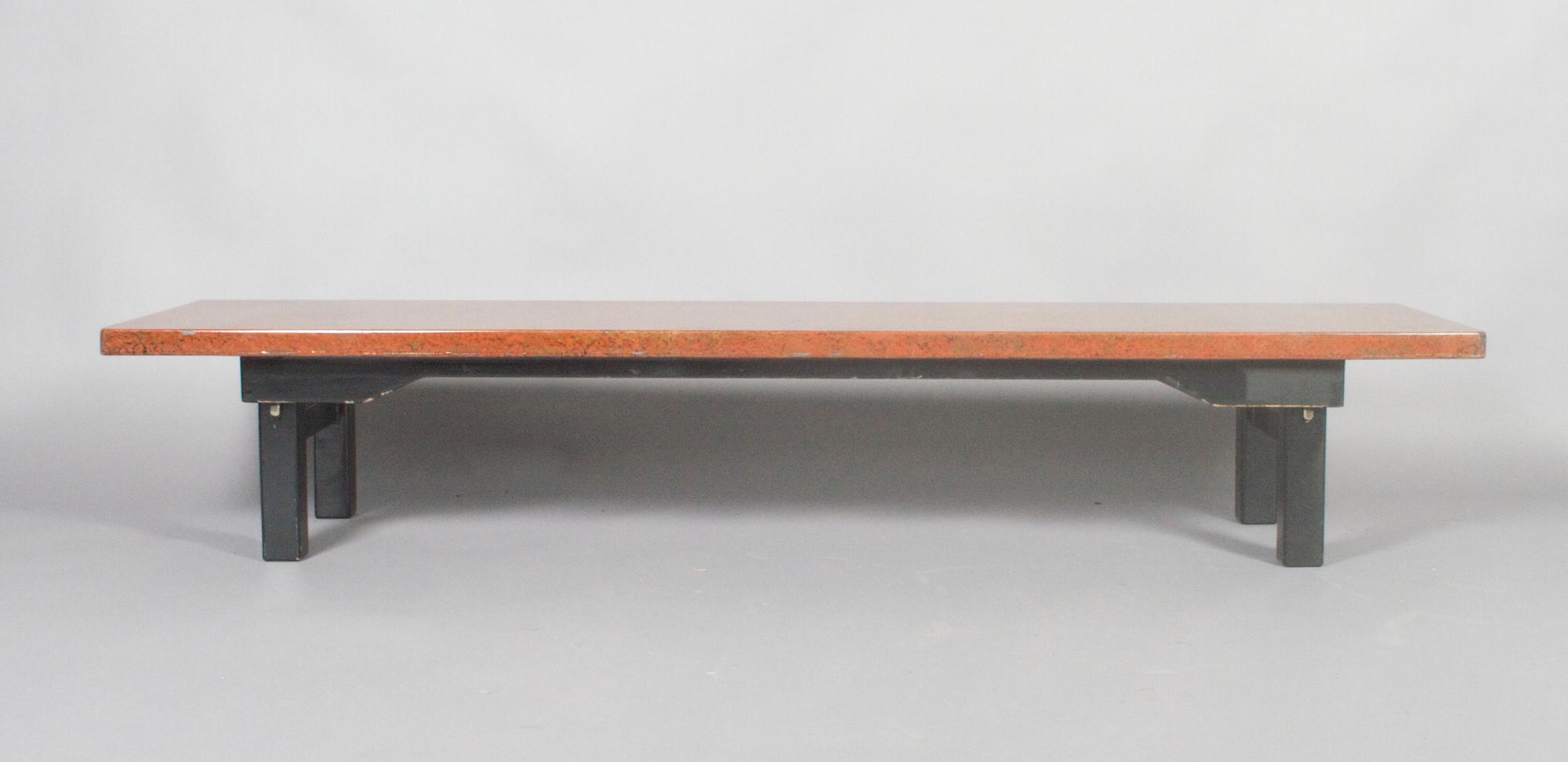 A Japanese Lacquered Low Table, Height 12 1/2 x width 71 x depth 17 3/4 inches.