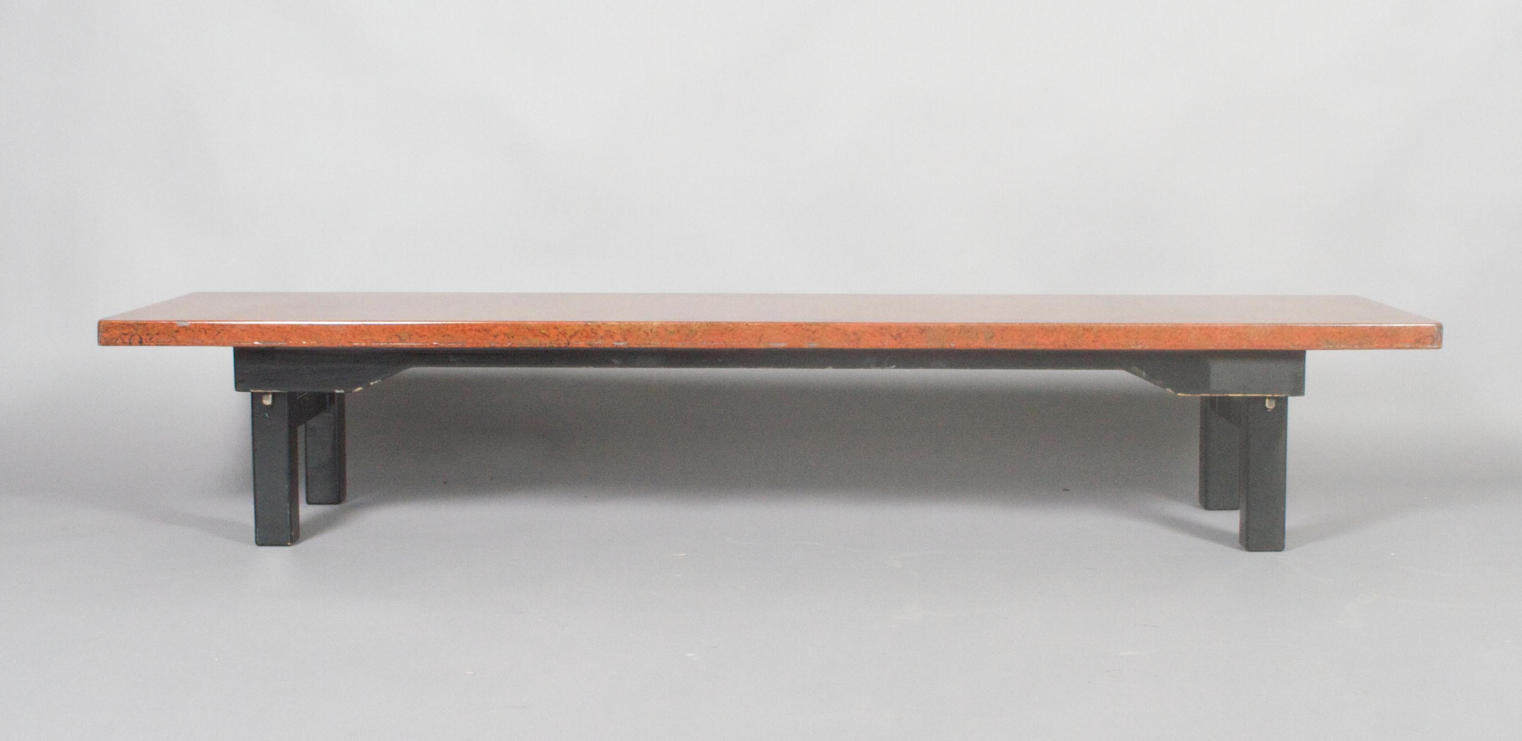 A Japanese Lacquered Low Table, Height 12 1/2 x width 71 x depth 17 3/4 inches.