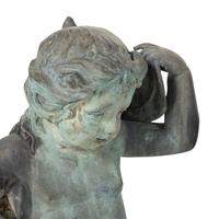 A Patinated Bronze Fountain Figure of a Youth Atop a Dolphin