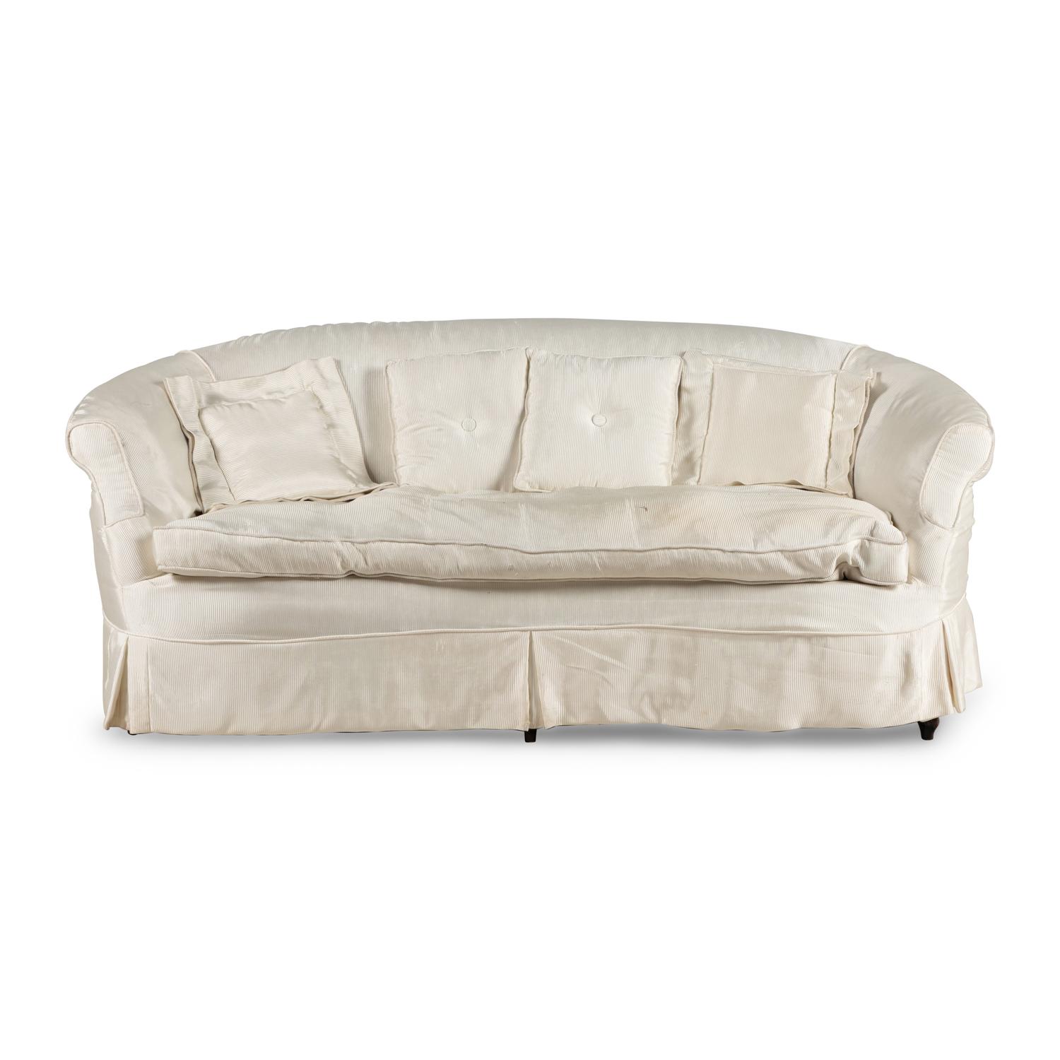 A Cream Silk-Slipcovered Reniform Sofa