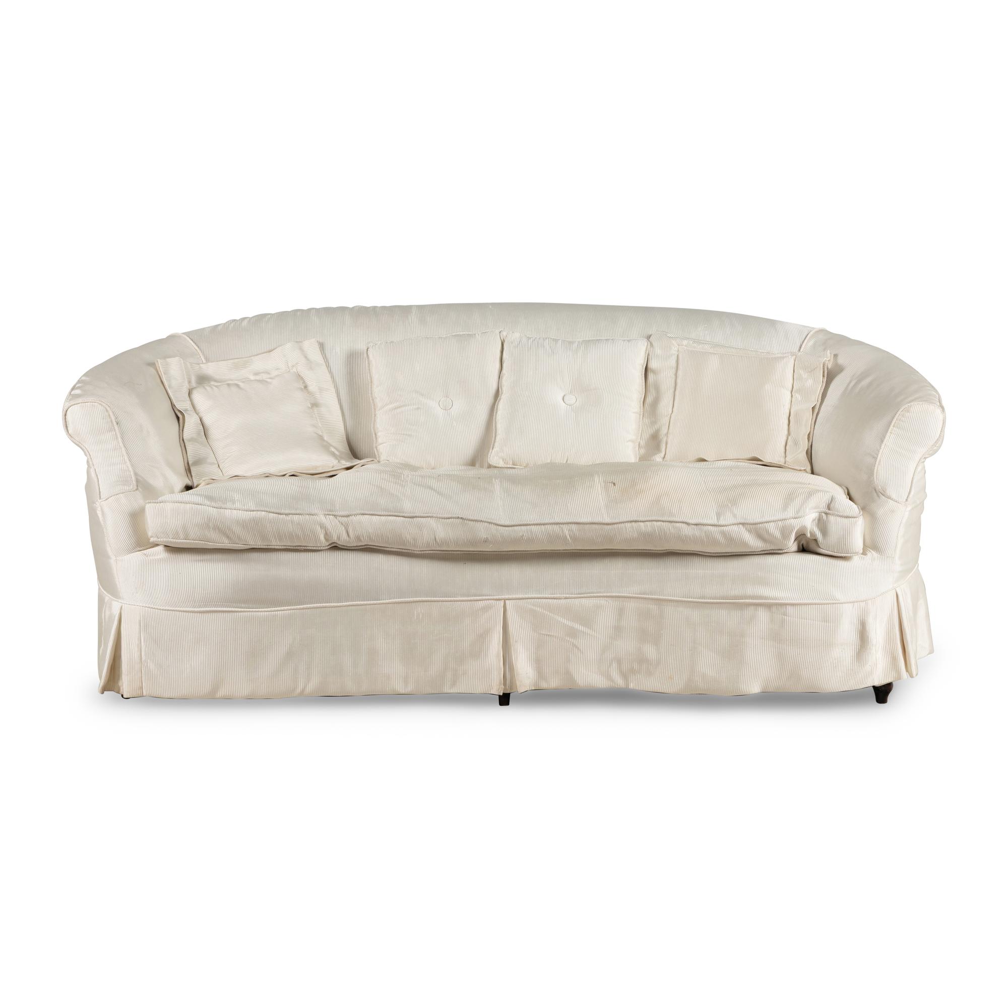 A Cream Silk-Slipcovered Reniform Sofa