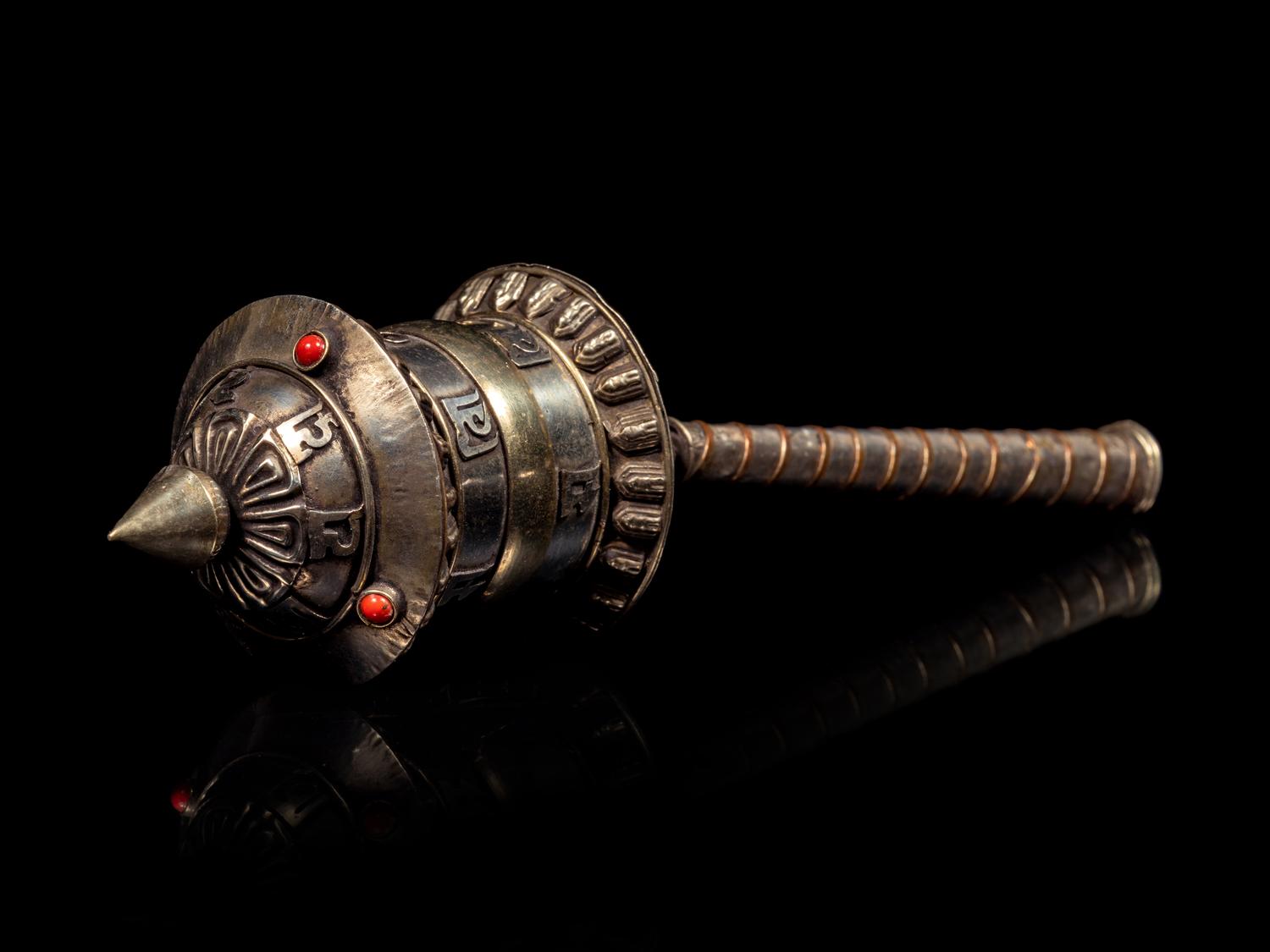 A Tibetan Silver Praying Wheel