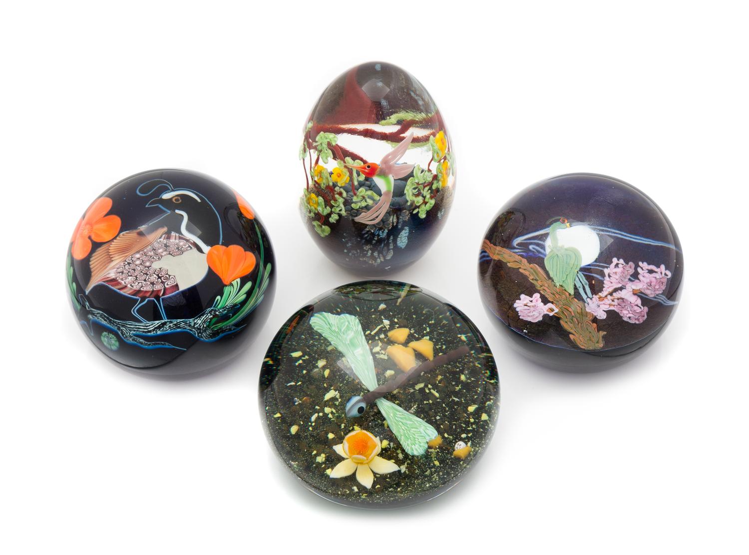 Four Glass Paperweights Diameter of largest 3 1/4 inches
