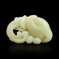 A Chinese carved white jade "Phoenix and Peach" large ornament